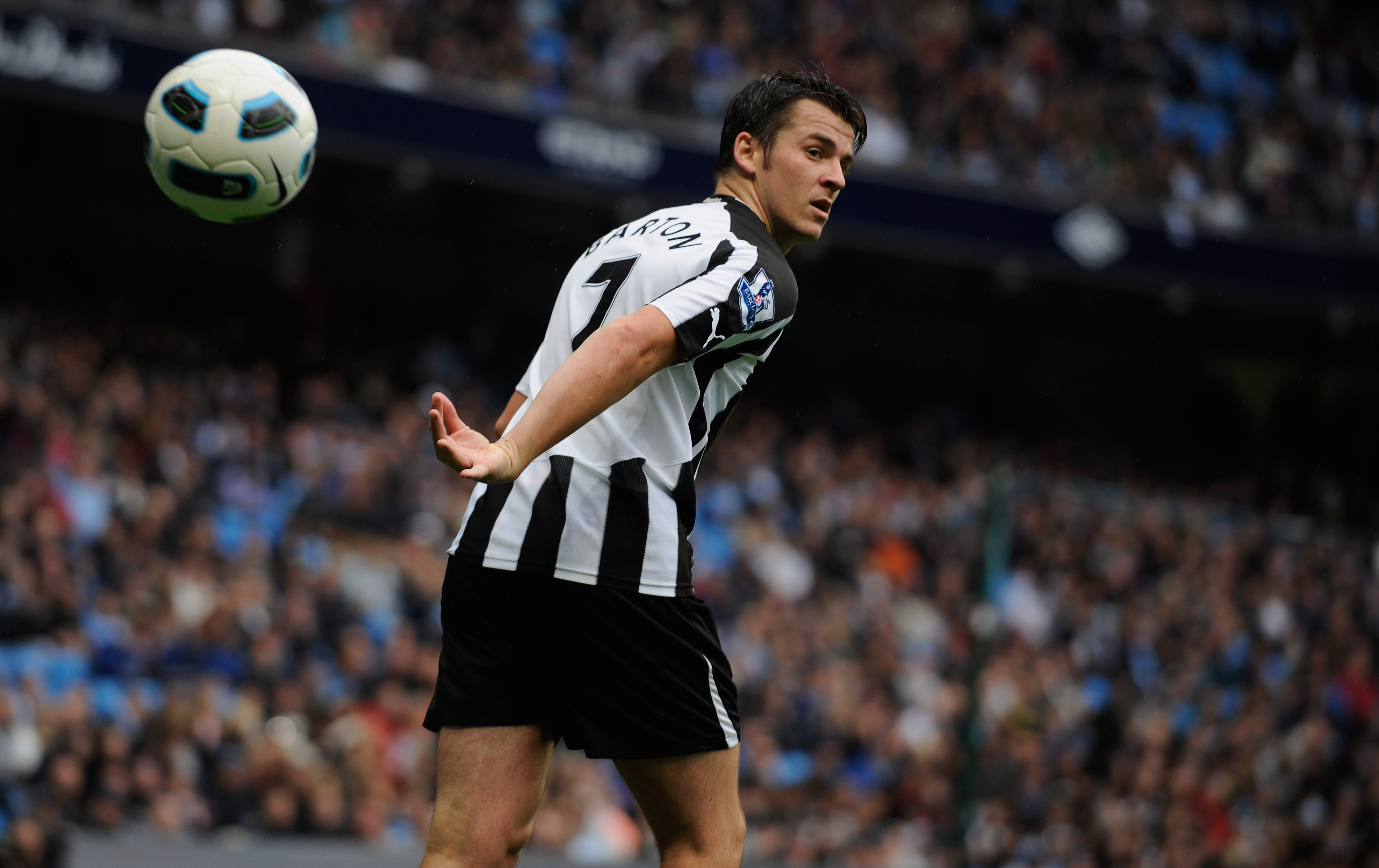 MANCHESTER, ENGLAND - OCTOBER 03: Joey Barton of Newcastle throws the ball during the Barclays Premier League match between Manchester City and Newcastle United at the City of Manchester Stadium on October 3, 2010 in Manchester, England.  (Photo by Michae