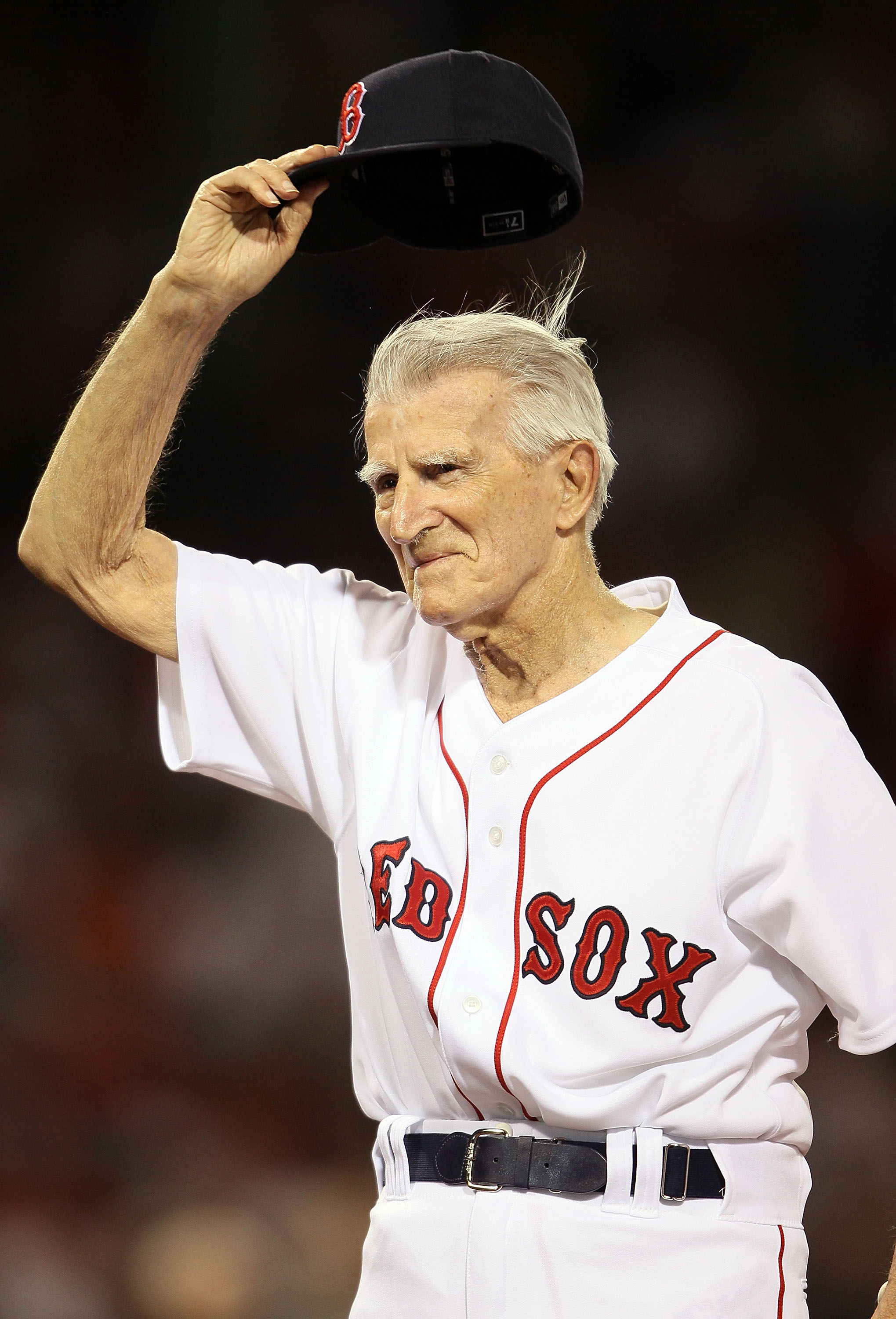 BOSTON - APRIL 04:  Boston Red Sox legend Johnny Pesky salutes the fans before the game against the New York Yankees on April 4, 2010 during Opening Night at Fenway Park in Boston, Massachusetts.  (Photo by Elsa/Getty Images)