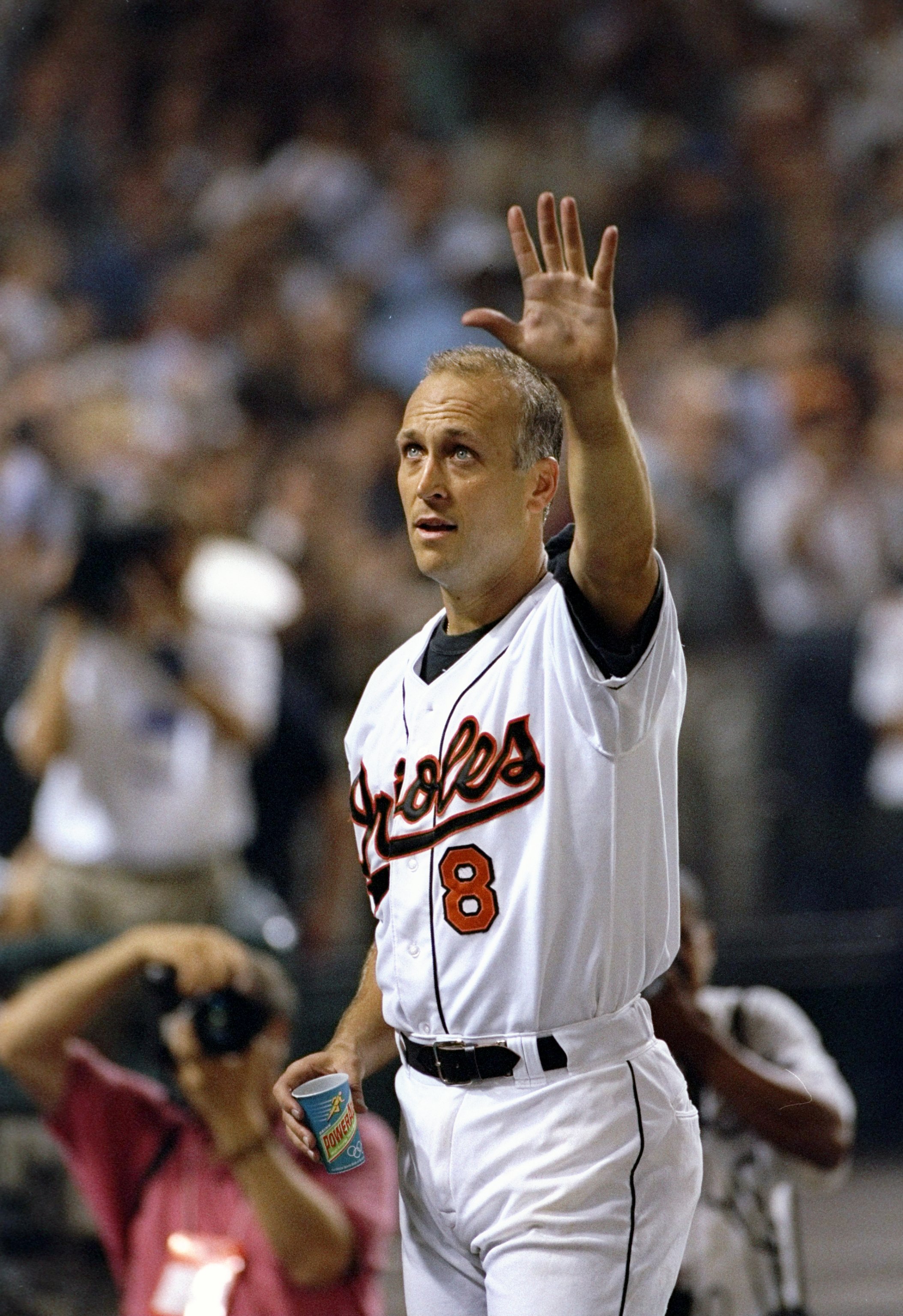 6 Sep 1995:  Shortstop Cal Ripken of the Baltimore Orioles raises hand to crowd at Camden Yards in Baltimore, Maryland  acknowledging congratulations for breaking Lou Gehrig''s record for consecutive games played.  The game was against the California Ange
