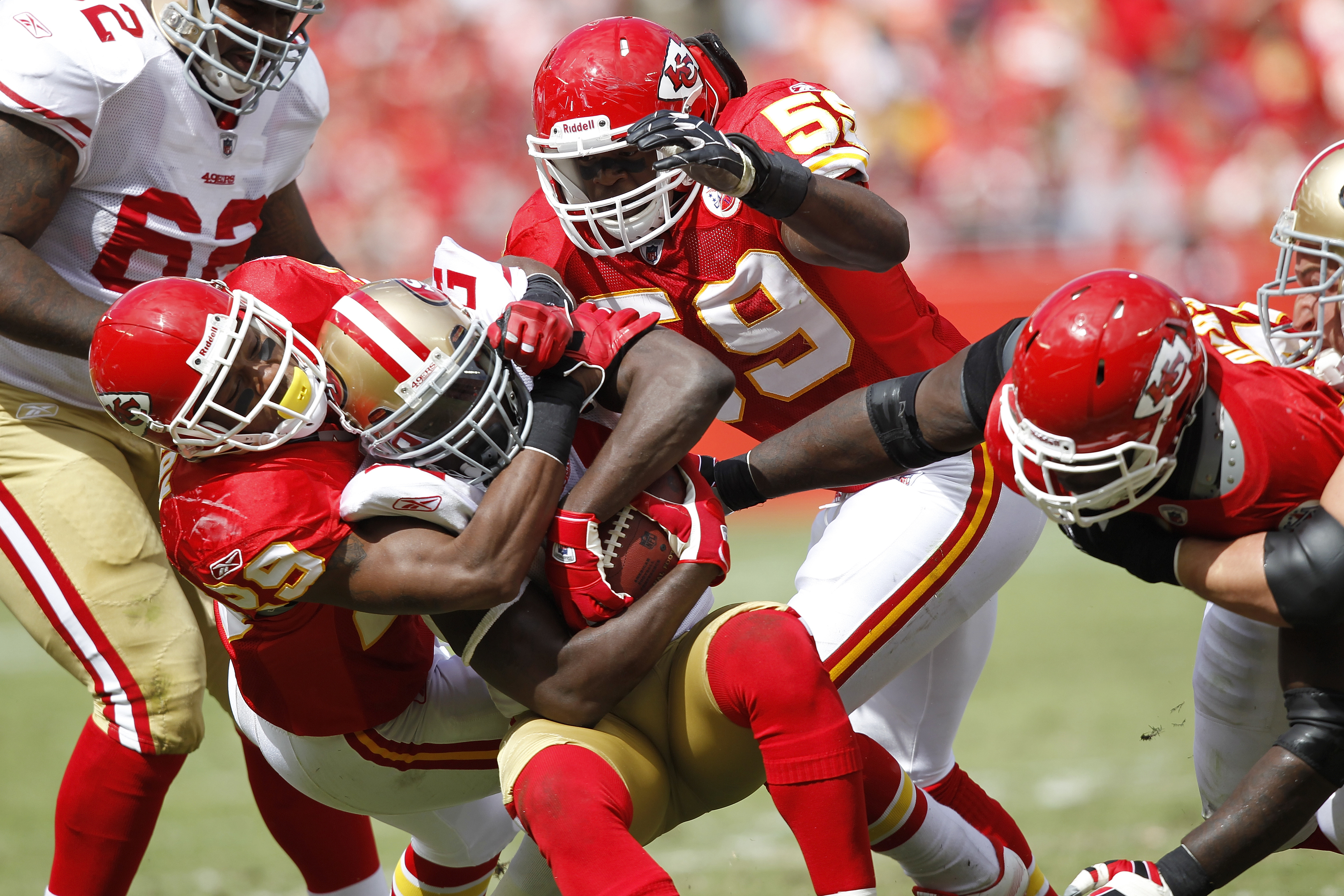 Kansas City Chiefs Head Coach Todd Haley talks to RB Jamaal Charles (25)  during play against the Oakland Raiders at the Coliseum in Oakland,  California on November 15, 2009. The Chiefs, wearing