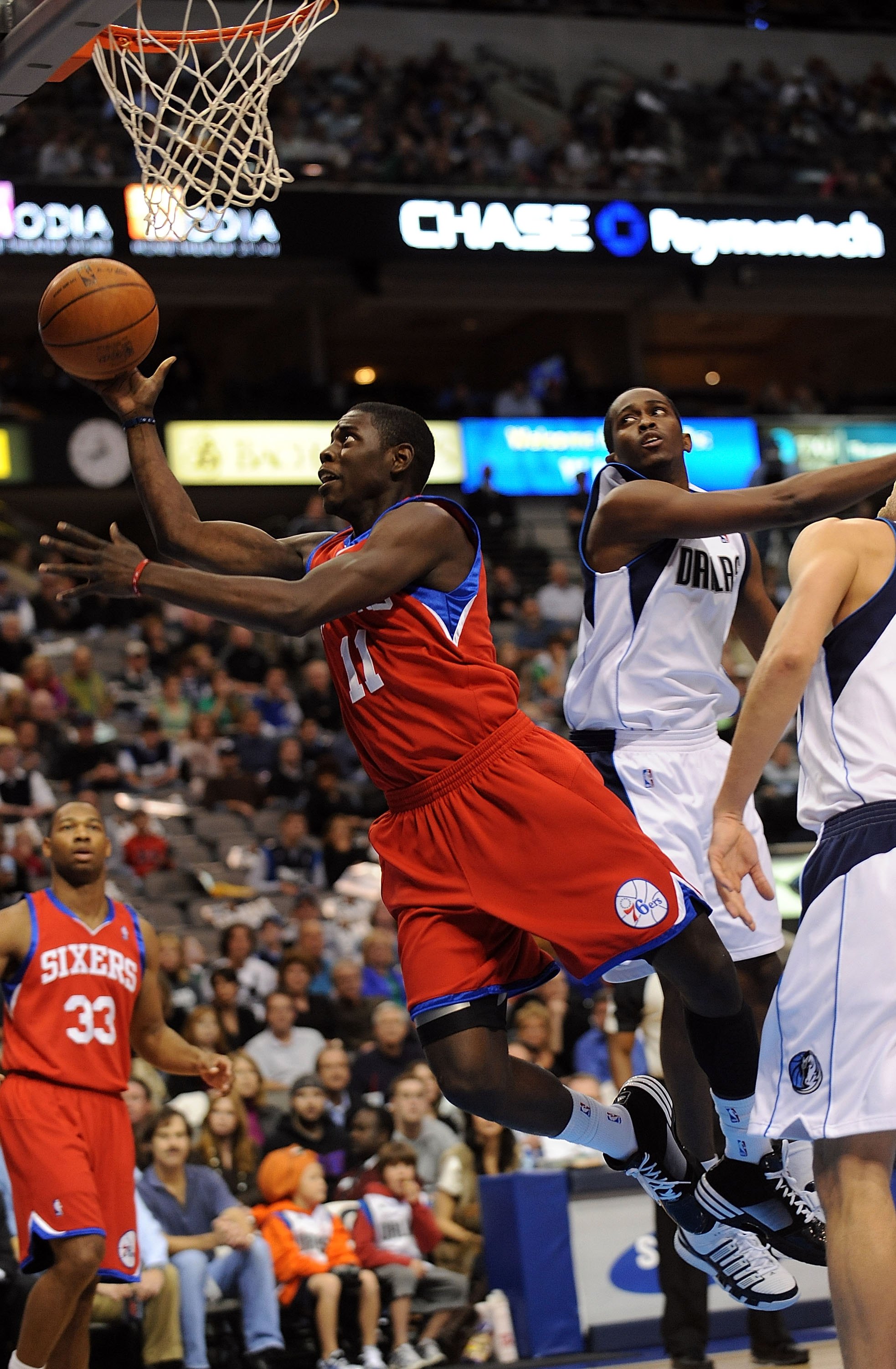 DALLAS - NOVEMBER 30:  Guard Jrue Holiday #11 of the Philadelphia 76ers on November 30, 2009 at American Airlines Center in Dallas, Texas.  NOTE TO USER: User expressly acknowledges and agrees that, by downloading and/or using this Photograph, user is con