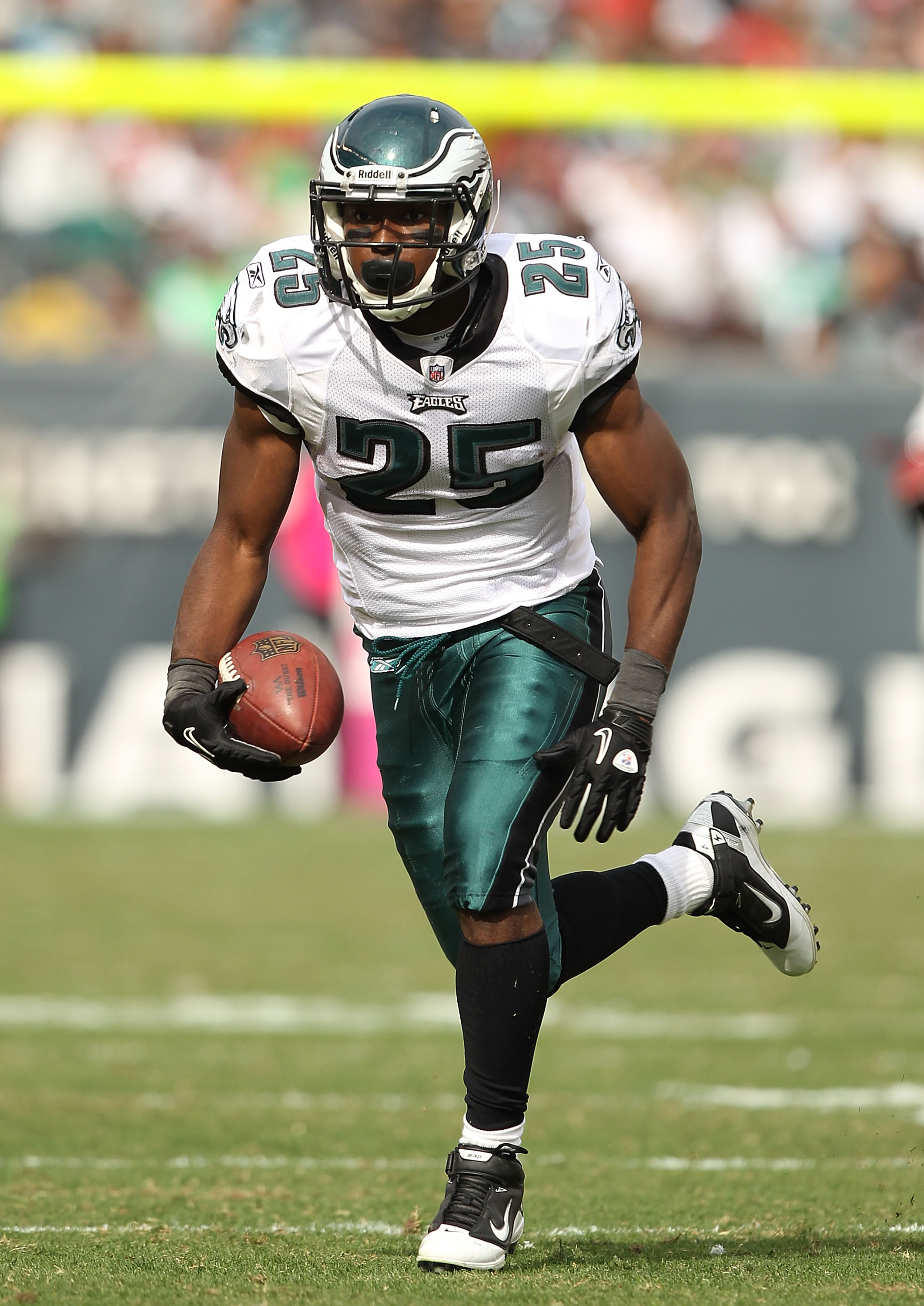 Philadelphia Eagles Asante Samuel walks off the field at the end of the  game carrying the game ball and the one he intercepted durning fourth  quarter Philadelphia Eagles-Indianapolis Colts game action in