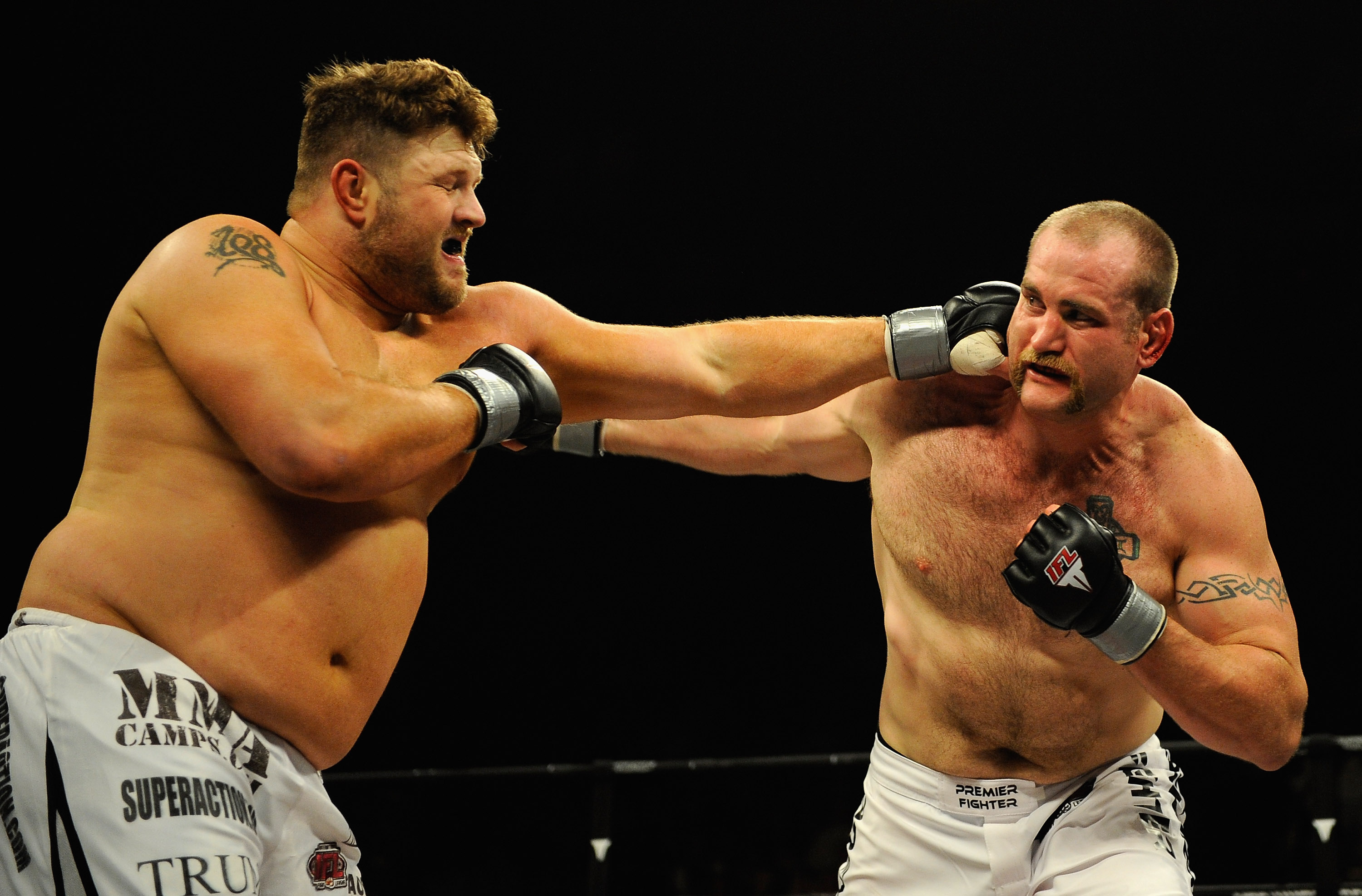 UNCASVILLE, CT - MAY 16:  Roy Nelson (L) of the Lions Den throws a punch at Brad Imes (R) MilesTech Fighting System during their bout presented by the International Fighting League at the Mohegan Sun Arena May 16, 2008 in Uncasville, Connecticut.  (Photo