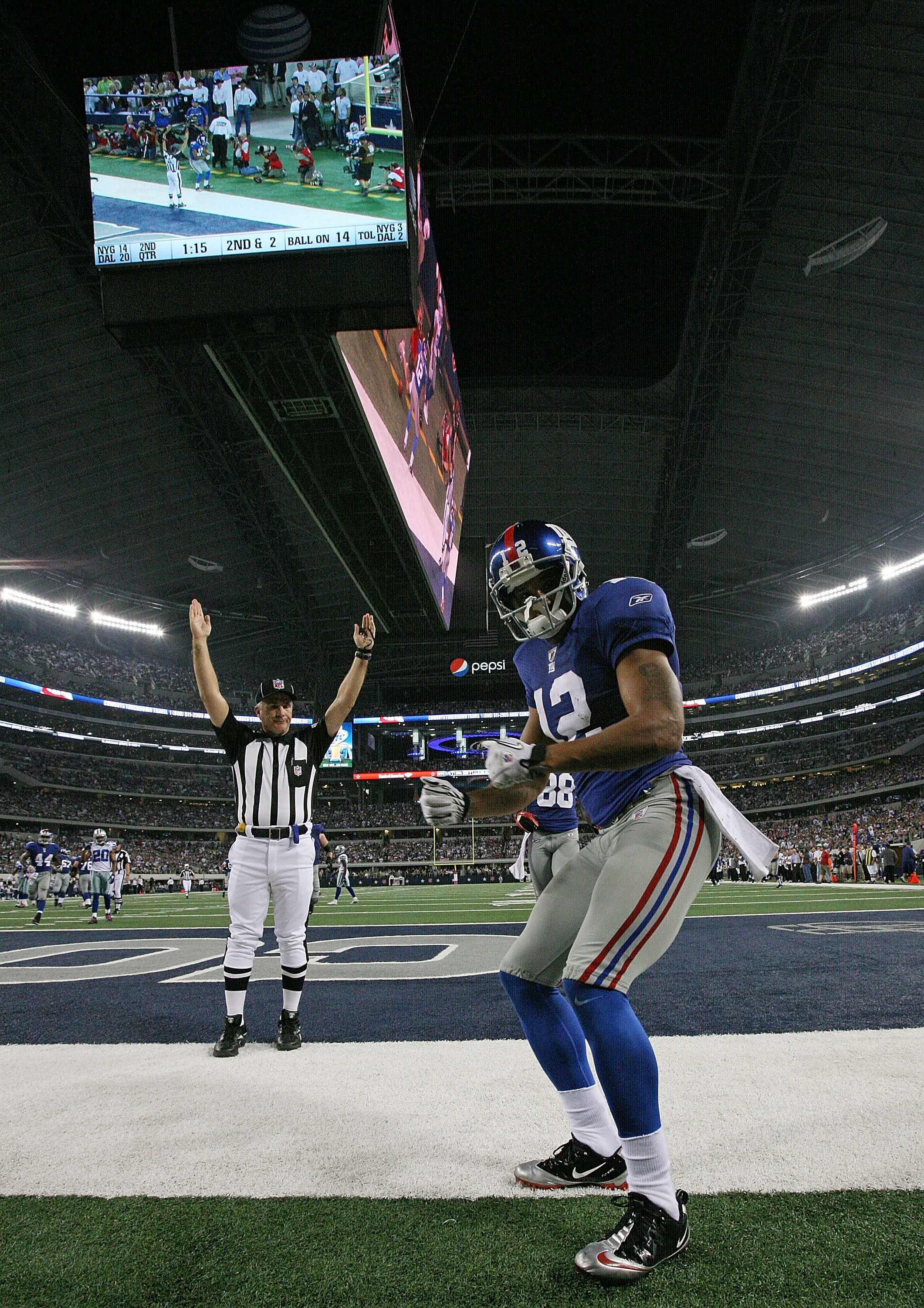 ARLINGTON, TX - OCTOBER 25:  Wide receiver Steve Smith #12 of the New York Giants celebrates a touchdown against the Dallas Cowboys in the second quarter at Cowboys Stadium on October 25, 2010 in Arlington, Texas.  (Photo by Ronald Martinez/Getty Images)