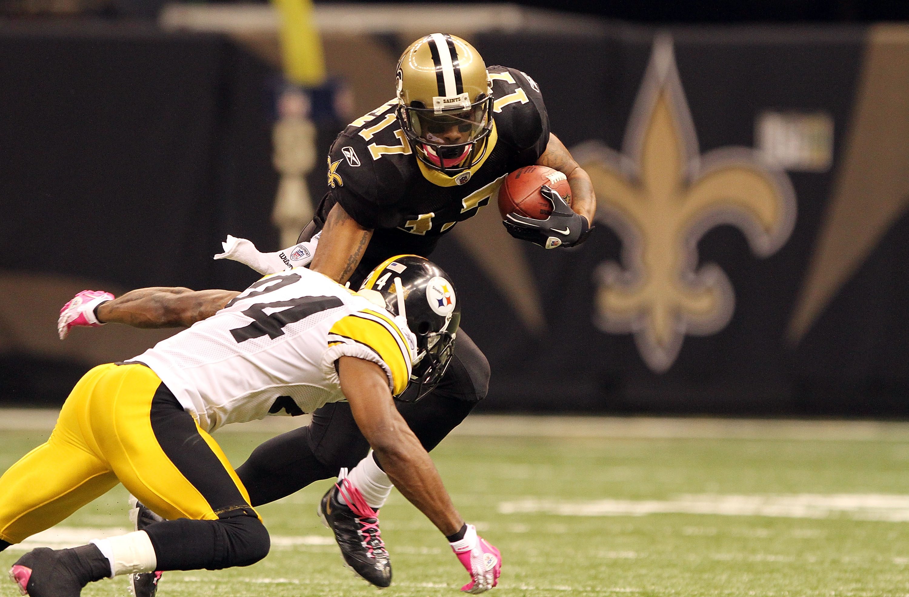 NEW ORLEANS, LA - OCTOBER 31: Robert Meachem #17 of the New Orleans Saints is tackled by Ike Taylor #24 of the Pittsburgh Steelers at the Louisiana Superdome on October 31, 2010 in New Orleans, Louisiana. (Photo by Matthew Sharpe/Getty Images)