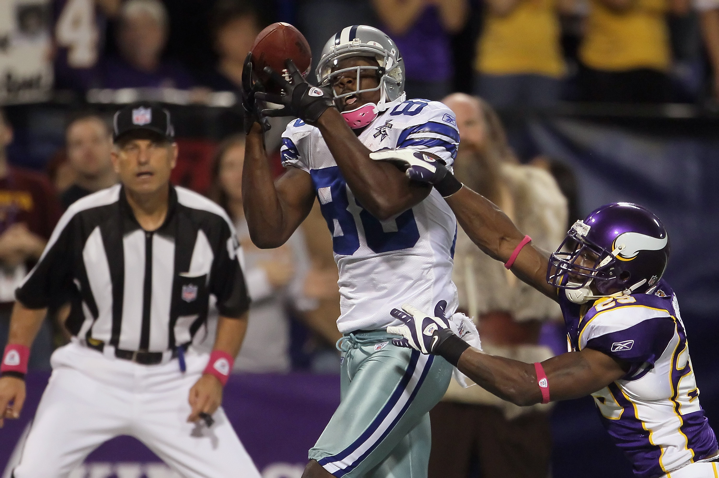 MINNEAPOLIS - OCTOBER 17:  Wide receiver Dez Bryant #88 of the Dallas Cowboys catches a pass for a touchdown as Lito Sheppard #29 of the Minnesota Vikings misses the tackle during the fourth quarter at Mall of America Field on October 17, 2010 in Minneapo