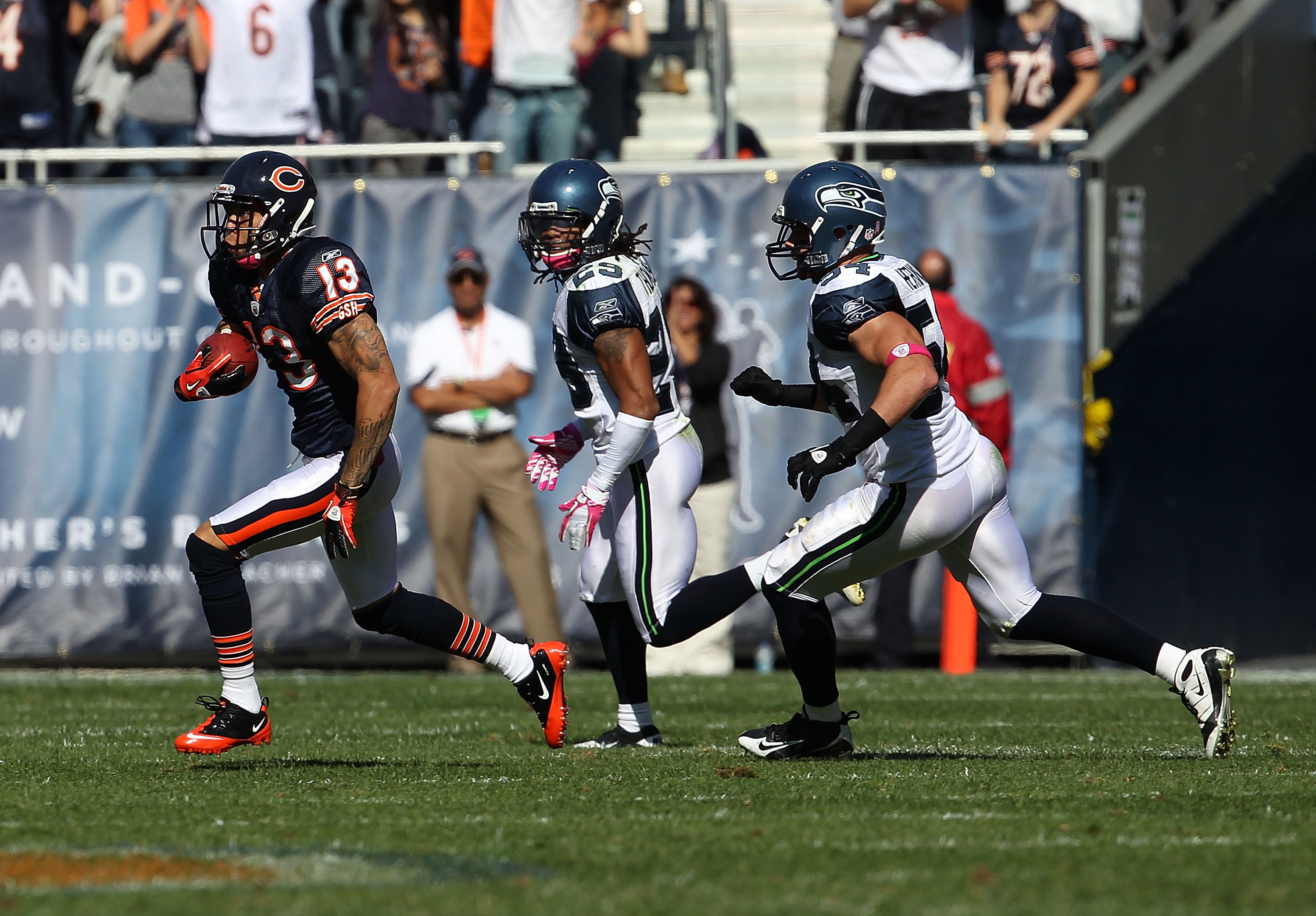CHICAGO - OCTOBER 17: Johnny Knox #13 of the Chicago Bears runs past Walter Thurmond #28 and Will Herring #54 of the Seattle Seahawks at Soldier Field on October 17, 2010 in Chicago, Illinois. The Seahawks defeated the Bears 23-30. (Photo by Jonathan Dani