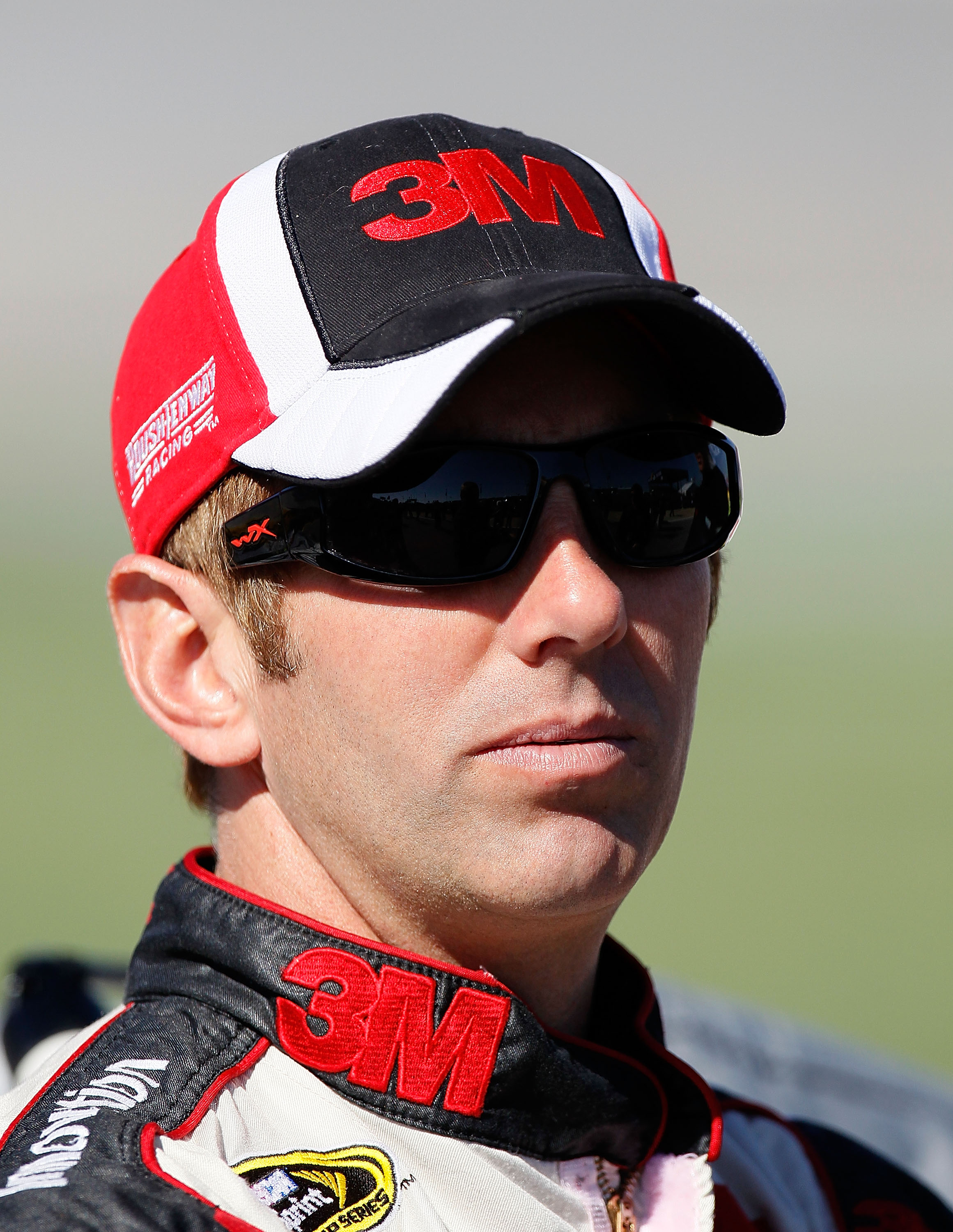 TALLADEGA, AL - OCTOBER 30:  Greg Biffle, driver of the #16 3M Ford, stands on pit road during qualifying for the NASCAR Sprint Cup Series AMP Energy Juice 500 at Talladega Superspeedway on October 30, 2010 in Talladega, Alabama.  (Photo by Kevin C. Cox/G