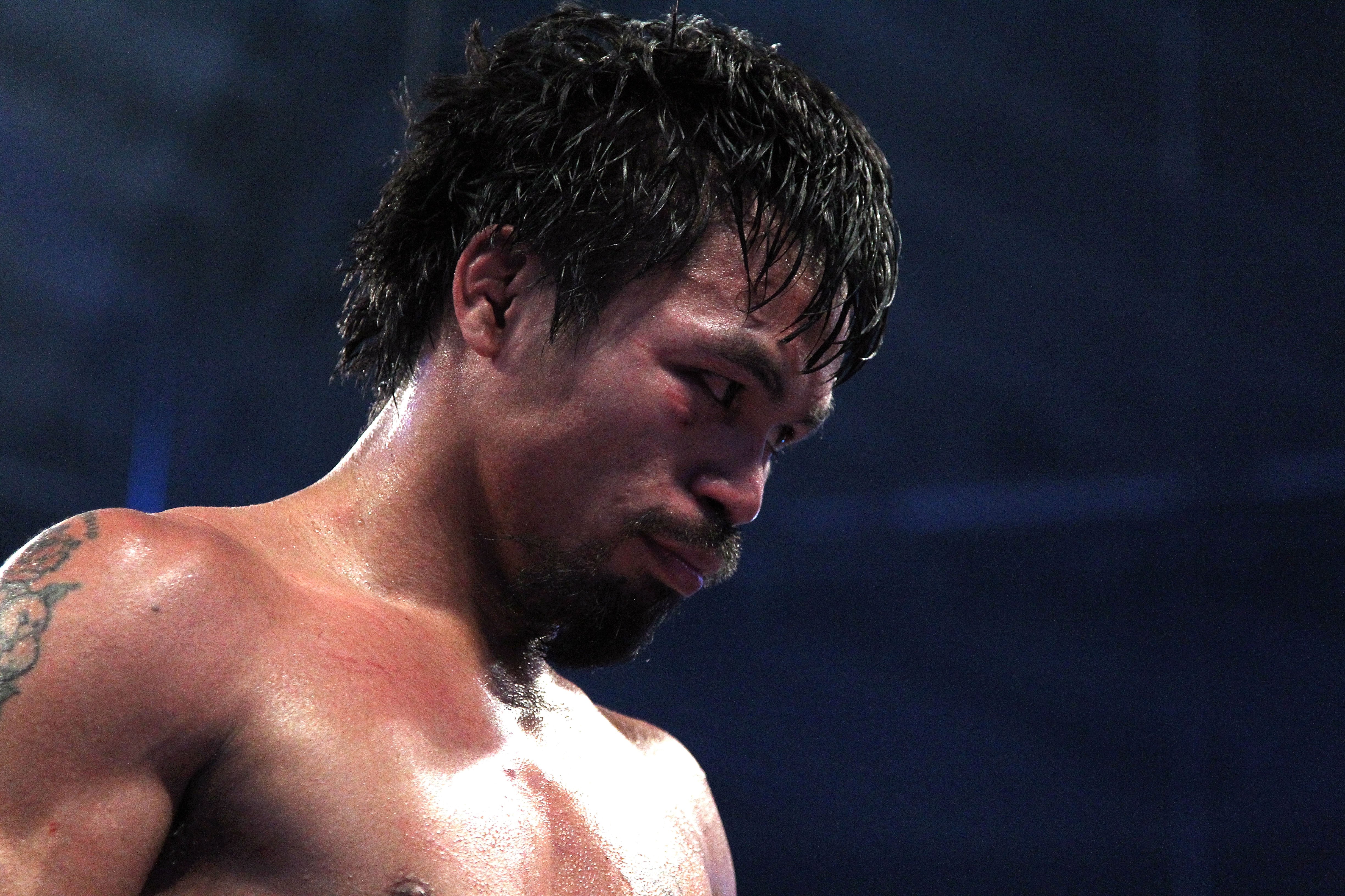ARLINGTON, TX - MARCH 13: Manny Pacquiao of the Philippines looks on in the ring against Joshua Clottey of Ghana during the WBO welterweight title fight at Cowboys Stadium on March 13, 2010 in Arlington, Texas. Pacquiao defeated Clottey by unanimous deci