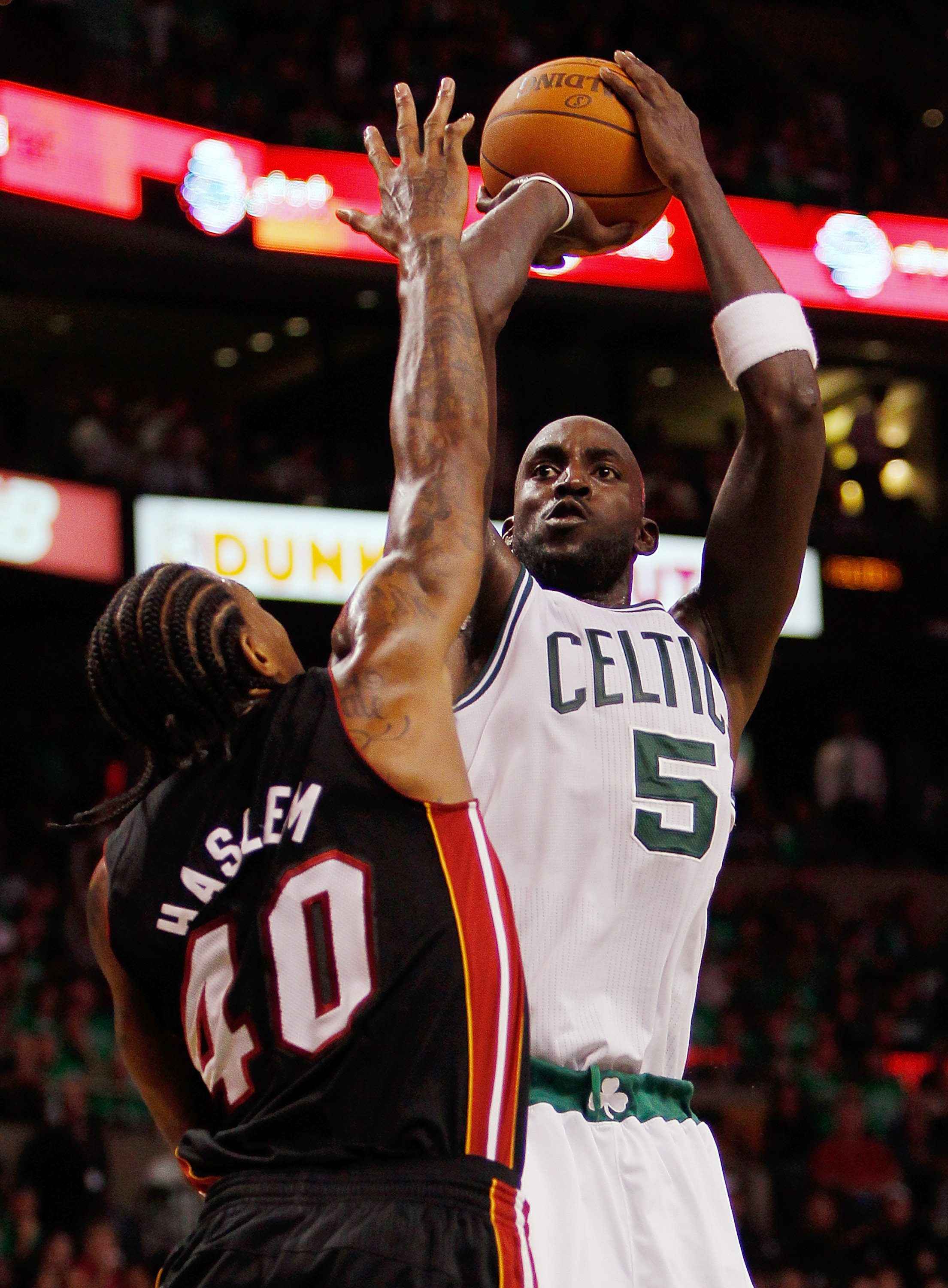 BOSTON, MA - OCTOBER 26: Kevin Garnett #5 of the Boston Celtics shots against the defense of Udonis Haslem #40 of the Miami Heat at the TD Banknorth Garden on October 26, 2010 in Boston, Massachusetts. NOTE TO USER: User expressly acknowledges and agrees