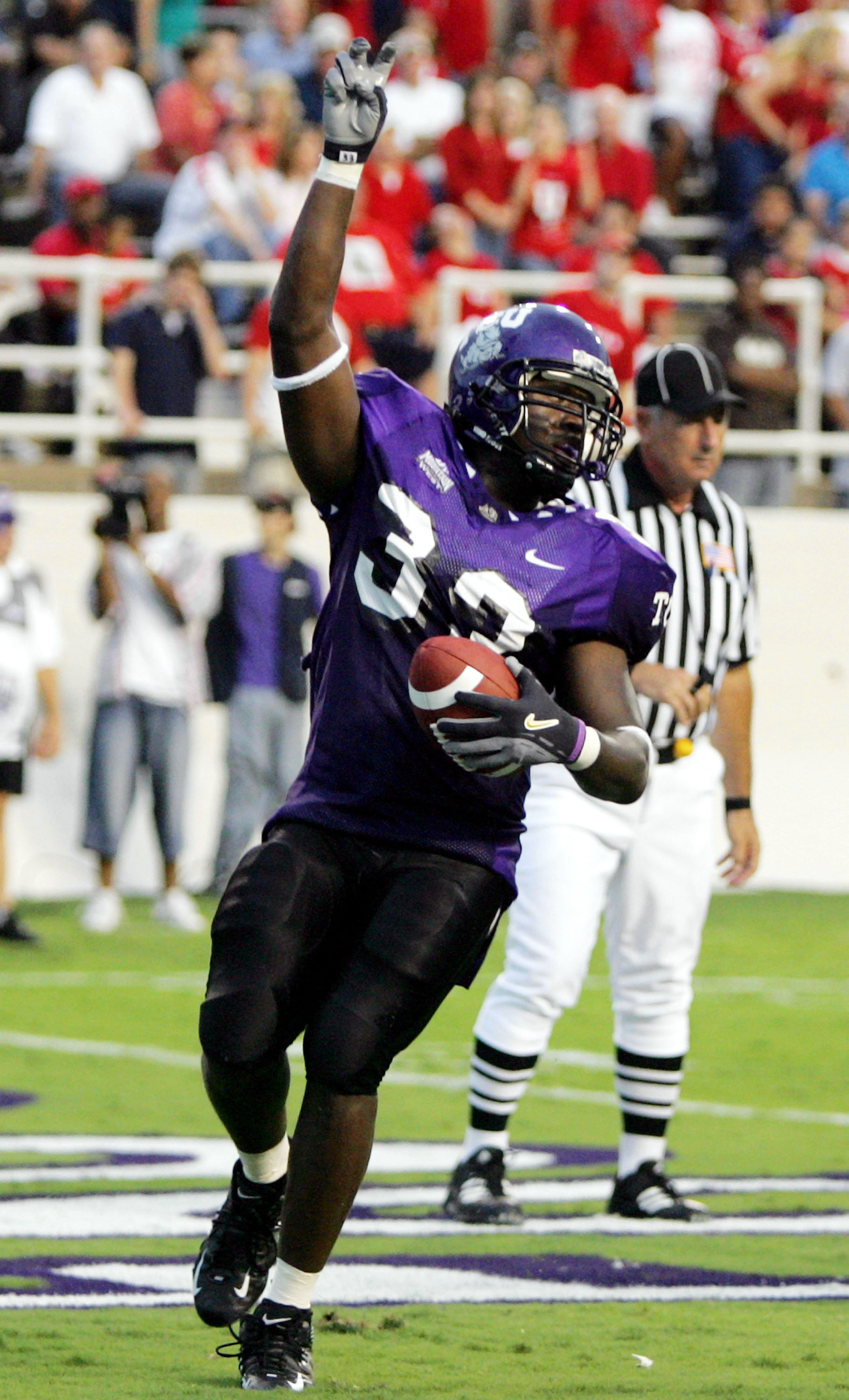 FORT WORTH, TX - SEPTEMBER 15:  Robert Merrill #33 of the Texas Christian University Horned Frogs runs for a touchdown against the Utah Utes on September 15, 2005 at Amon Carter Stadium in Fort Worth, Texas.  (Photo by Ronald Martinez/Getty Images)