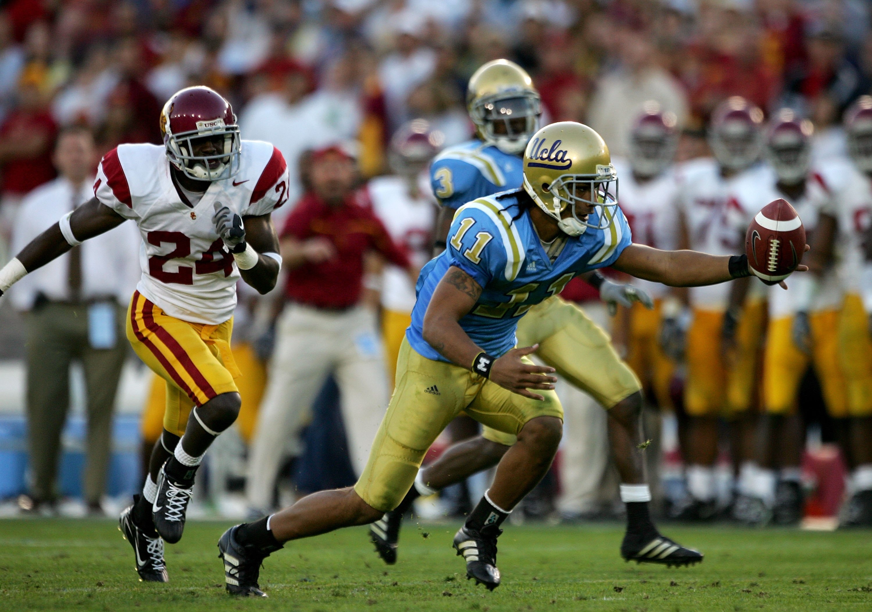 PASADENA, CA - DECEMBER 02: Dennis Keyes #11 of the UCLA Bruins tries to recover a fumble on a kickoff return during the game against the USC Trojans on December 2, 2006 at the Rose Bowl in Pasadena, California. The UCLA Bruins defeated the USC Trojans 1