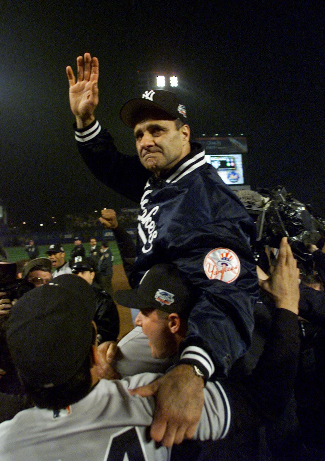 26 Oct 2000: Manager Joe Torre of the New York Yankees celebrates their 4-2 win over the New York Mets to win their third consecutive World Series Championship at Shea Stadium in Flushing, New York. <DIGITAL IMAGE> Mandatory Credit: Jed Jacobsohn/ALLSPOR