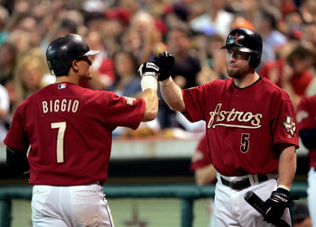 Boston Red Sox's Trot Nixon (7) is congratulated by starting pitcher David  Wells, center, and third baseman Bill Mueller, right, following his solo  home run during the second inning in Fort Myers