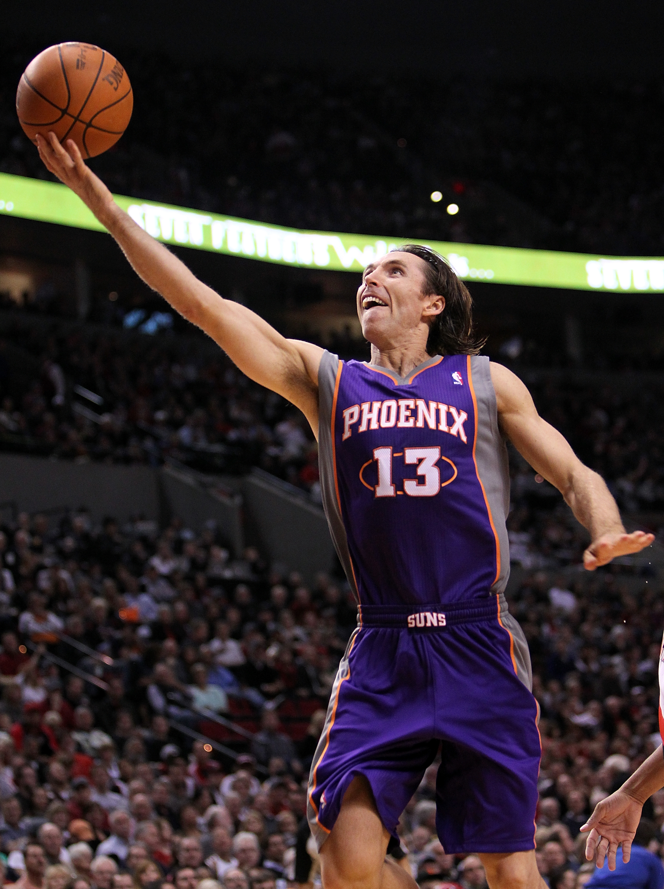 PORTLAND, OR - OCTOBER 26: Steve Nash #13 of the Phoenix Suns lays up the ball agianst the Portland Trail Blazers on October 26, 2010 at the Rose Garden in Portland, Oregon.  NOTE TO USER: User expressly acknowledges and agrees that, by downloading and or