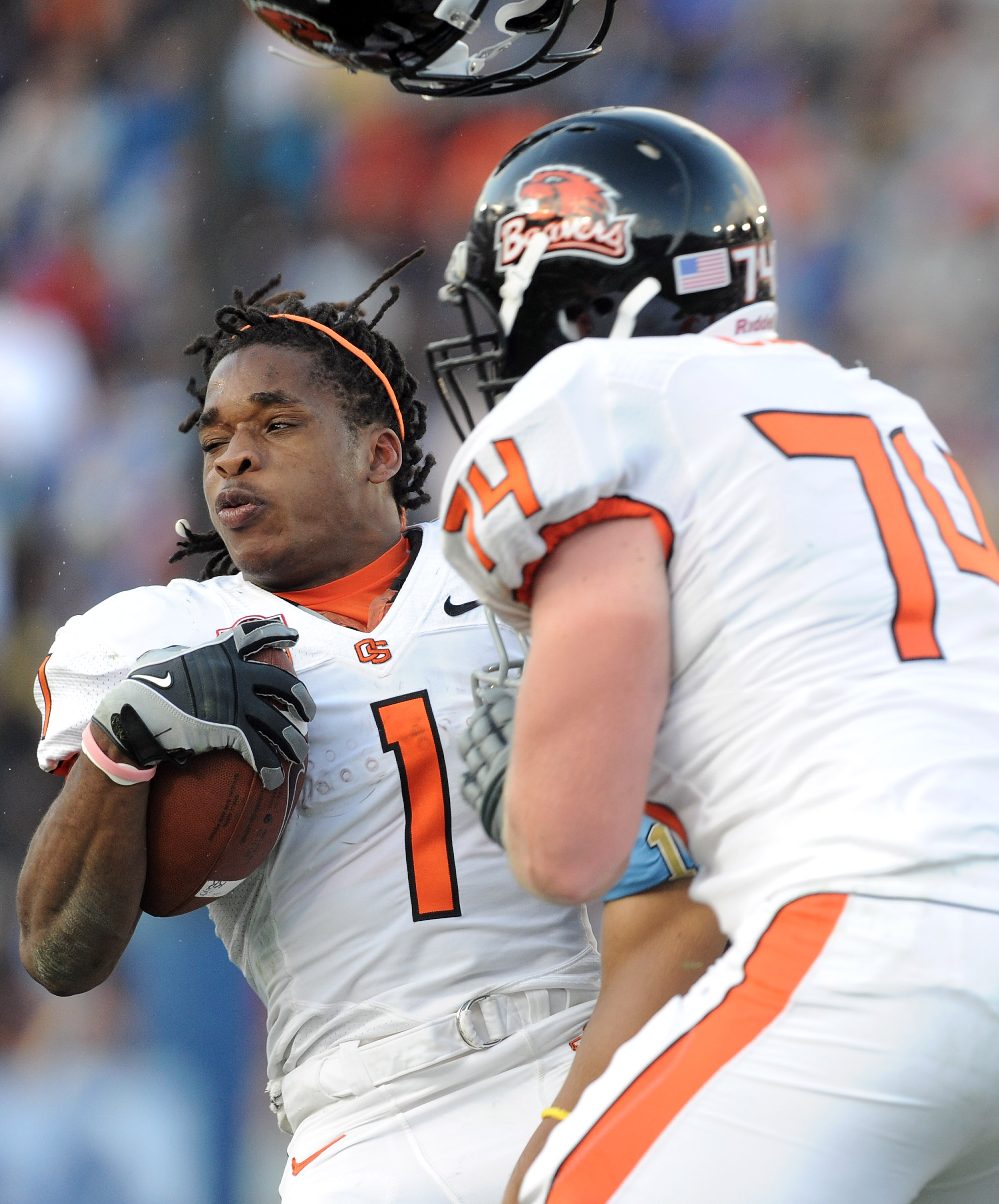 PASADENA, CA - NOVEMBER 06: Jacquizz Rodgers #1 of the Oregon State Beavers loses his helmet after a hit from Dietrich Riley #1 of the UCLA Bruins during the second quarter at the Rose Bowl on November 6, 2010 in Pasadena, California. (Photo by Harry Ho