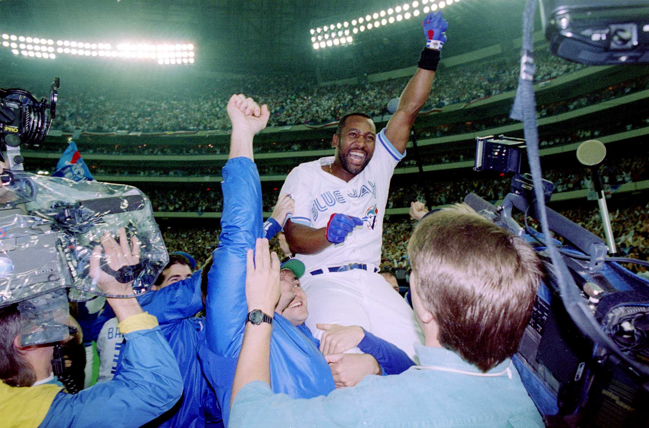 25 Oct 1993: Joe Carter is held aloft after hitting a three-run homer in the bottom of the ninth to win the World Series, four games to two, against the Philadelphia Phillies.