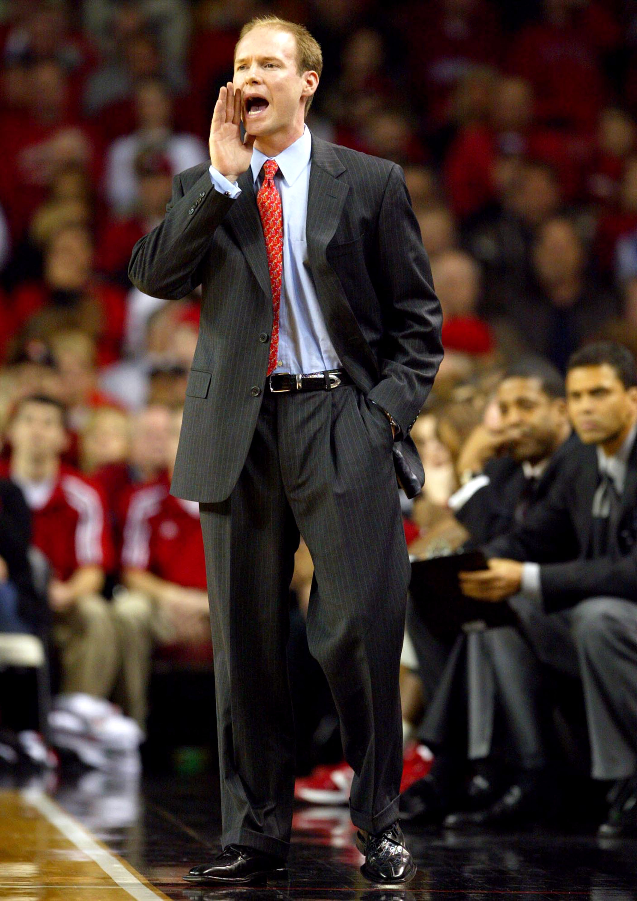 LOUISVILLE, KY - JANUARY 28: Kevin Willard the acting Head Coach of Louisville gives instructions to his team against Houston on January 28, 2004 at Freedom Hall in Louisville, Kentucky. Willard was filling in for Rick Pitino who was out for medical reas