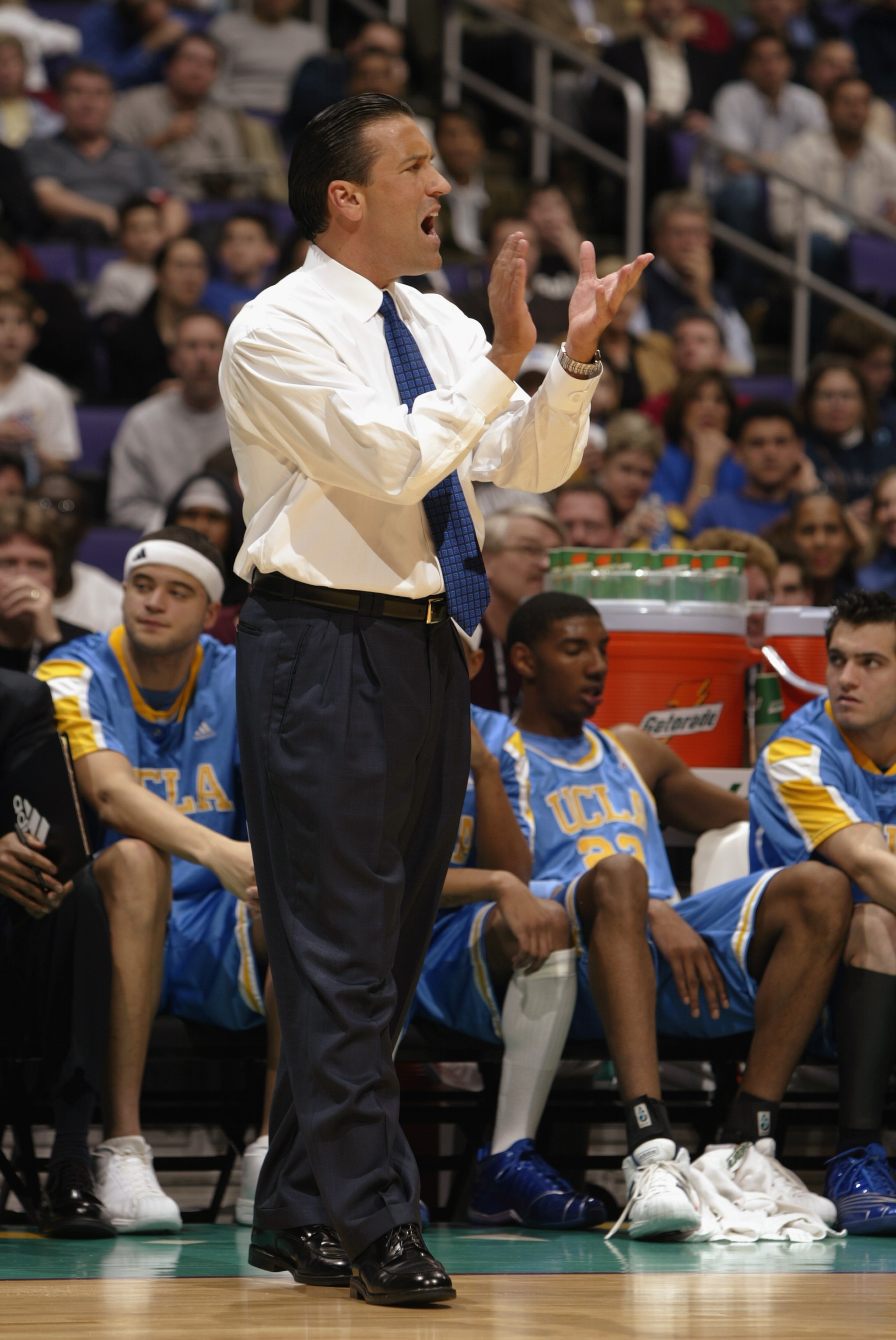 LOS ANGELES - MARCH 14: UCLA head coach Steve Lavin encourages his team during the NCAA Pac-10 Conference tournament semifinals game against Oregon at the Staples Center on March 14, 2003 in Los Angeles, California. In what could be Lavin's last game at