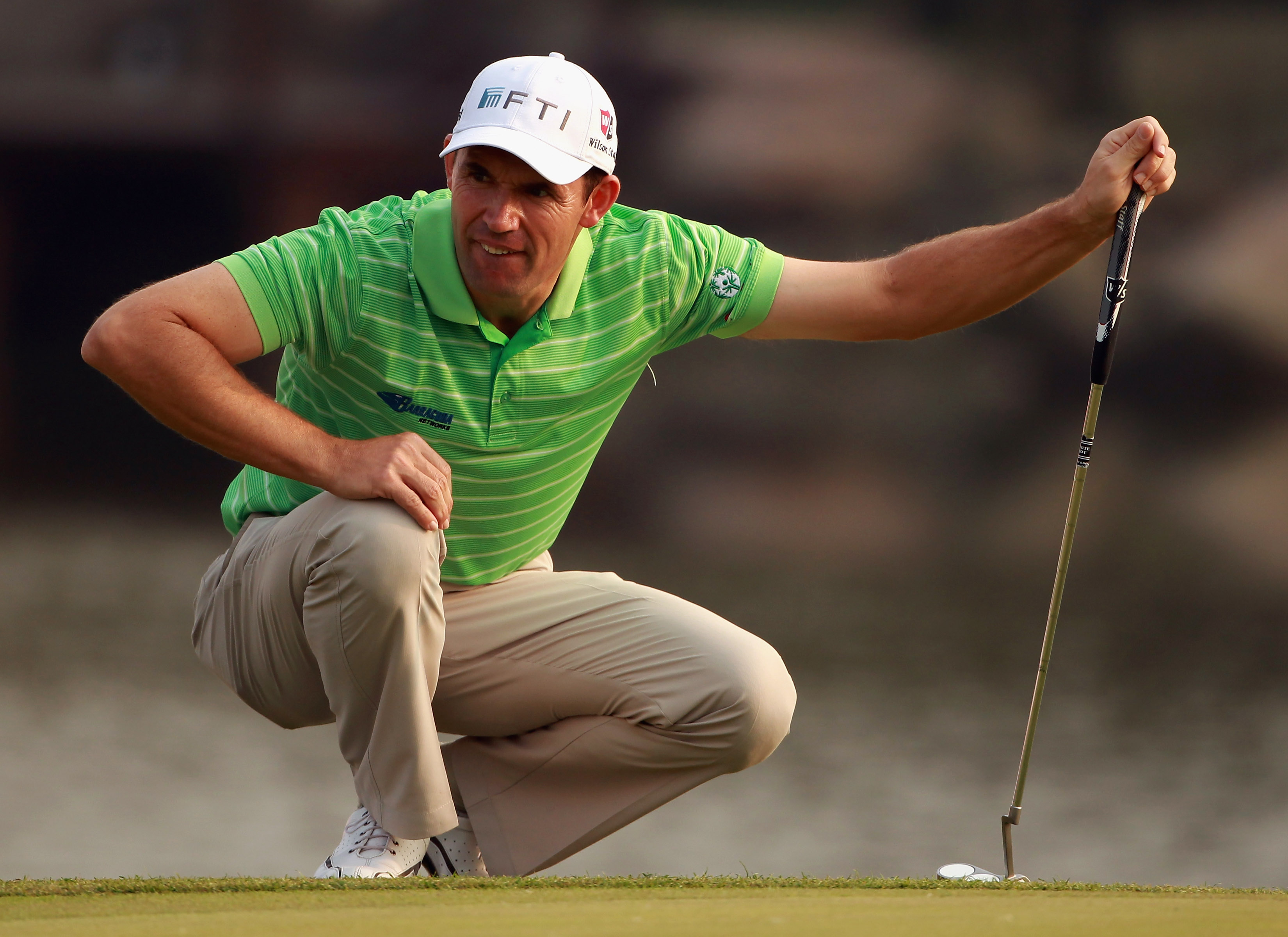 SHANGHAI, CHINA - NOVEMBER 06:  Padraig Harrington of Ireland lines up a putt on the 18th hole during the third round of the WGC-HSBC Champions at Sheshan International Golf Club on November 6, 2010 in Shanghai, China.  (Photo by Andrew Redington/Getty Im