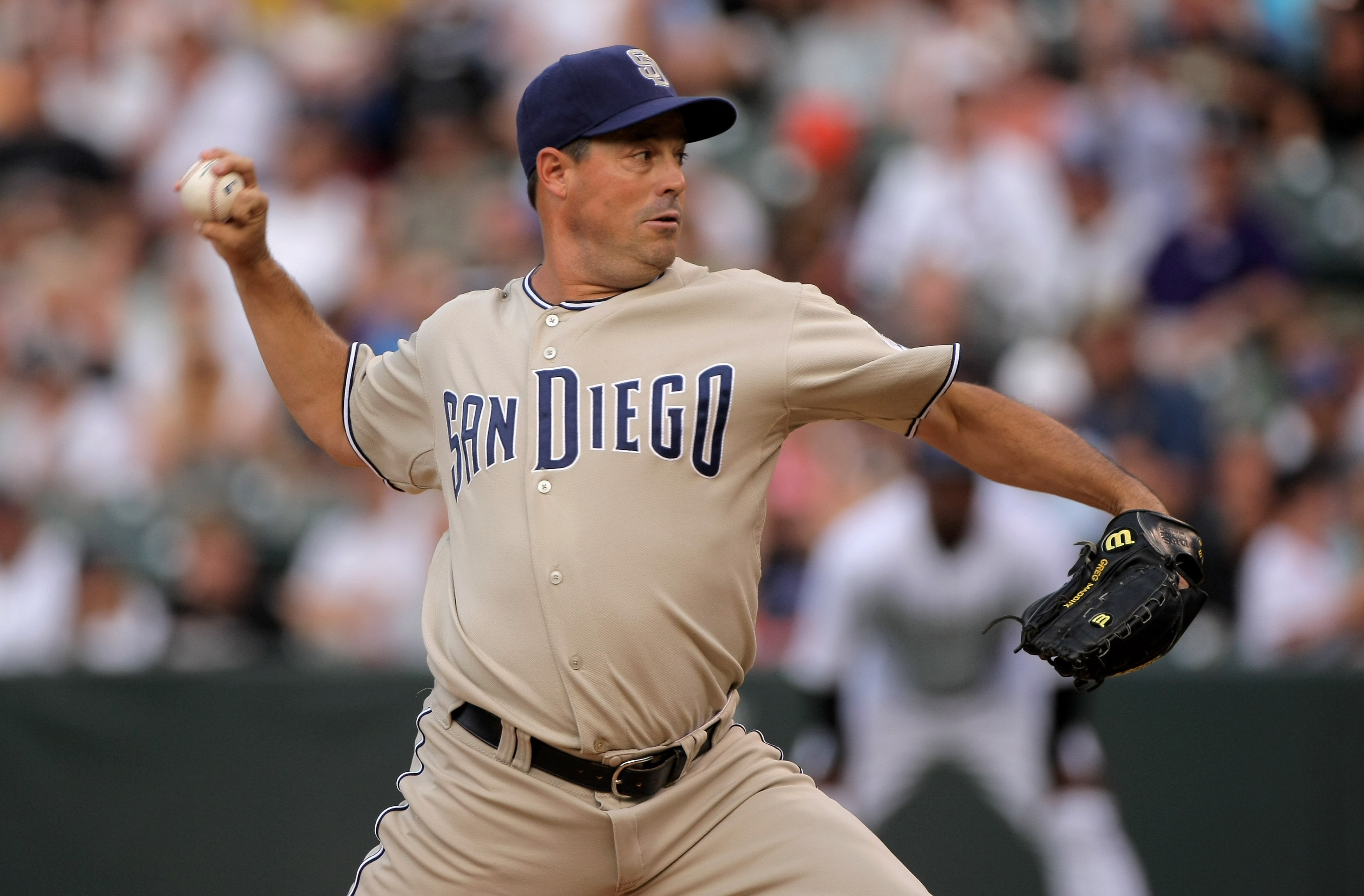 San Diego Padres starting pitcher Greg Maddux delivers a pitch to