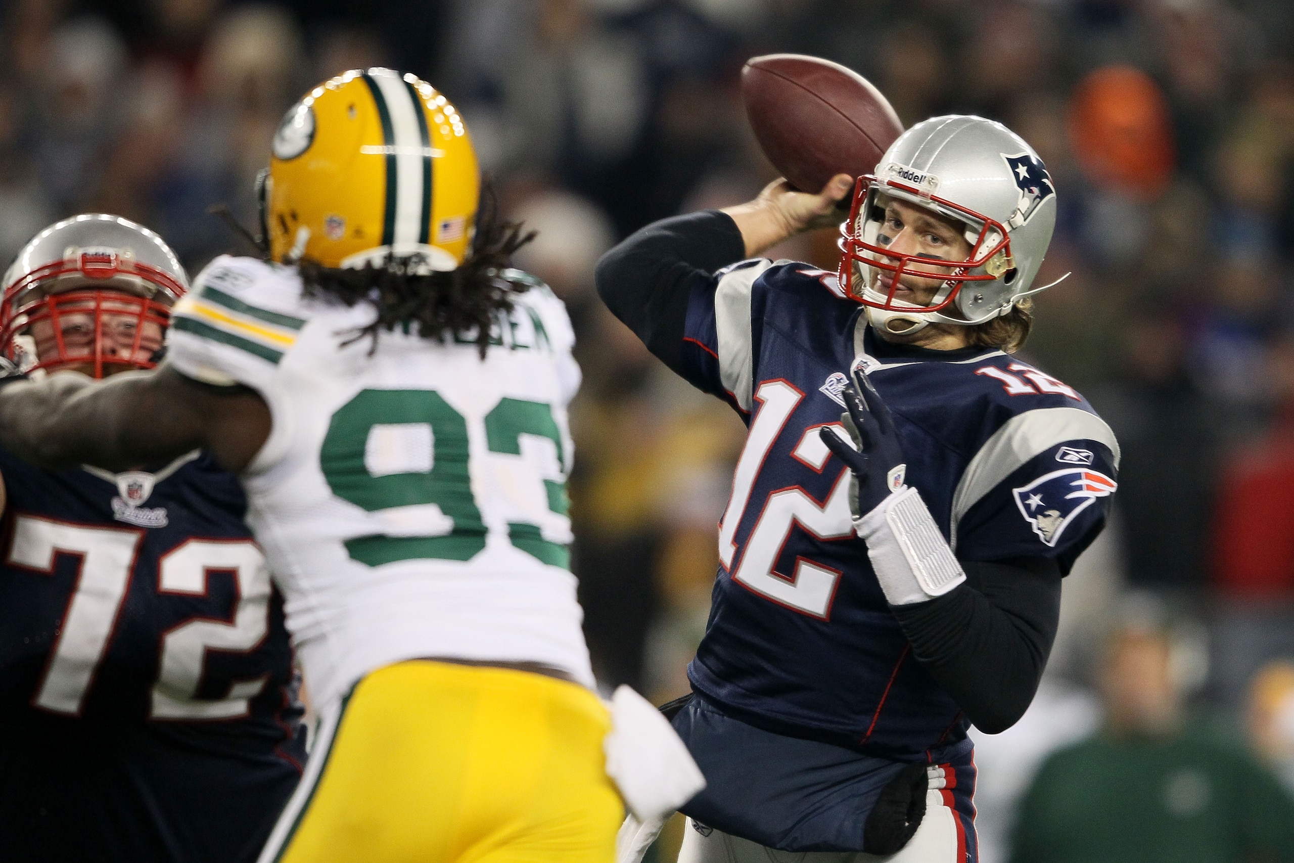 FOXBORO, MA - DECEMBER 19: Quarterback Tom Brady #12 of the New England Patriots throws a touchdown pass to tight end Aaron Hernandez #85 (not pictured) in the fourth quarter of the game against the Green Bay Packers at Gillette Stadium on December 19, 2 FOXBORO, MA - DECEMBER 19: Quarterback Tom Brady #12 of the New England Patriots throws a touchdown pass to tight end Aaron Hernandez #85 (not pictured) in the fourth quarter of the game against the Green Bay Packers at Gillette Stadium on December 19, 2