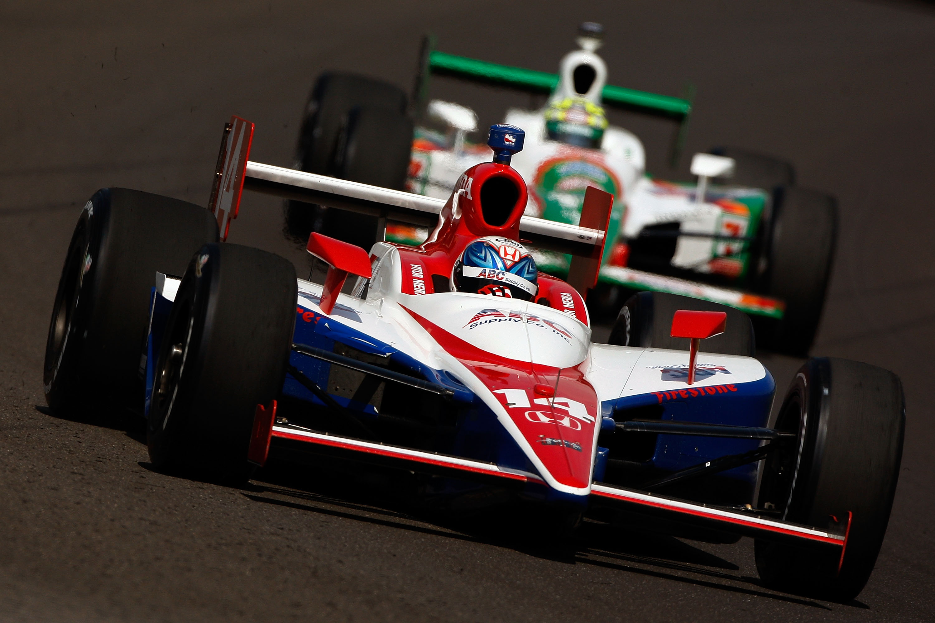 INDIANAPOLIS - MAY 22: Vitor Meira drives in the #14 ABC Supply Co AJ Foyt Racing Dallara Honda ahead of Tony Kanaan in the #11 Team 7-Eleven Andretti Green Racing Dallara Honda during Miller Lite Carb Day practice for the IRL IndyCar Series 93rd running