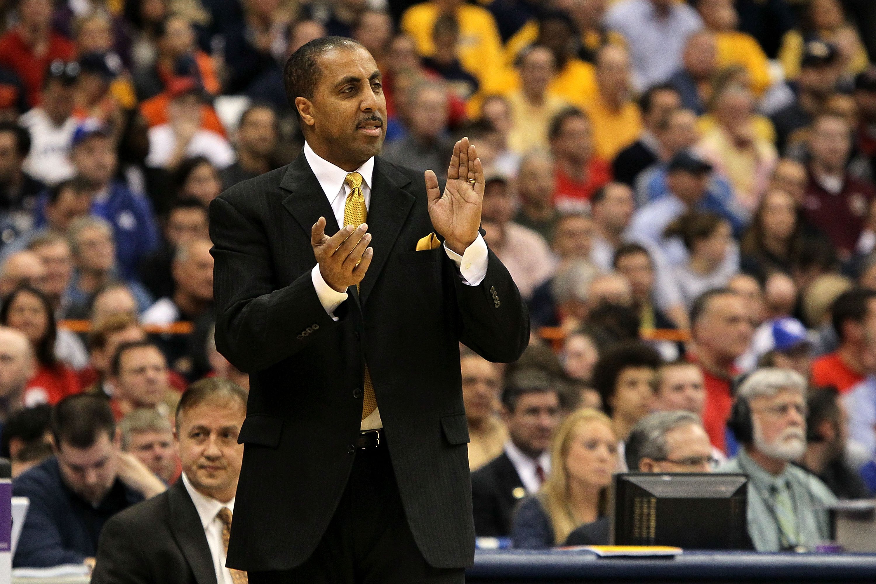 SYRACUSE, NY - MARCH 25: Head coach Lorenzo Romar of the Washington Huskies coaches against the West Virginia Mountaineers during the east regional semifinal of the 2010 NCAA men's basketball tournament at the Carrier Dome on March 25, 2010 in Syracuse,