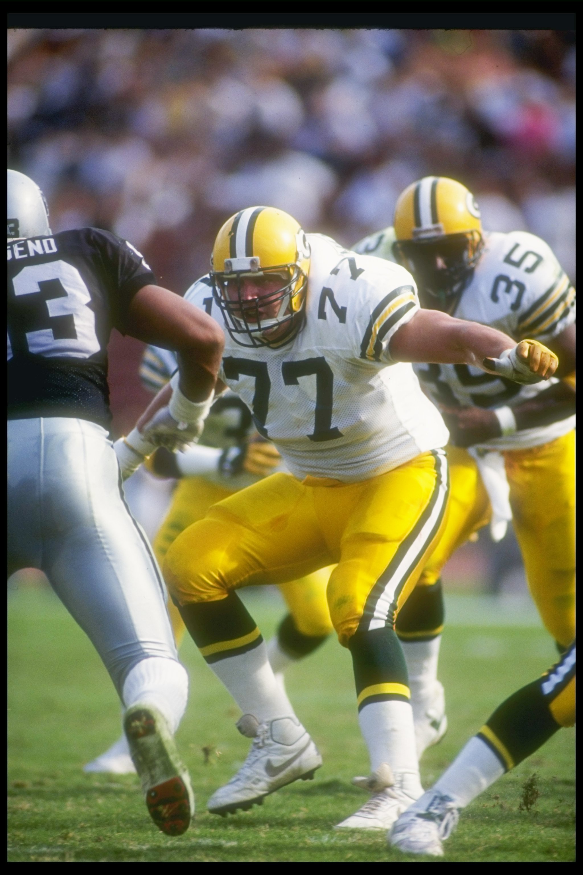 11 Nov 1990:  Offensive lineman Tony Mandarich of the Green Bay Packers looks to block a Los Angeles Raiders player during a game at the Los Angeles Memorial Coliseum in Los Angeles, California.  The Packers won the game, 29-16. Mandatory Credit: Ken Levi