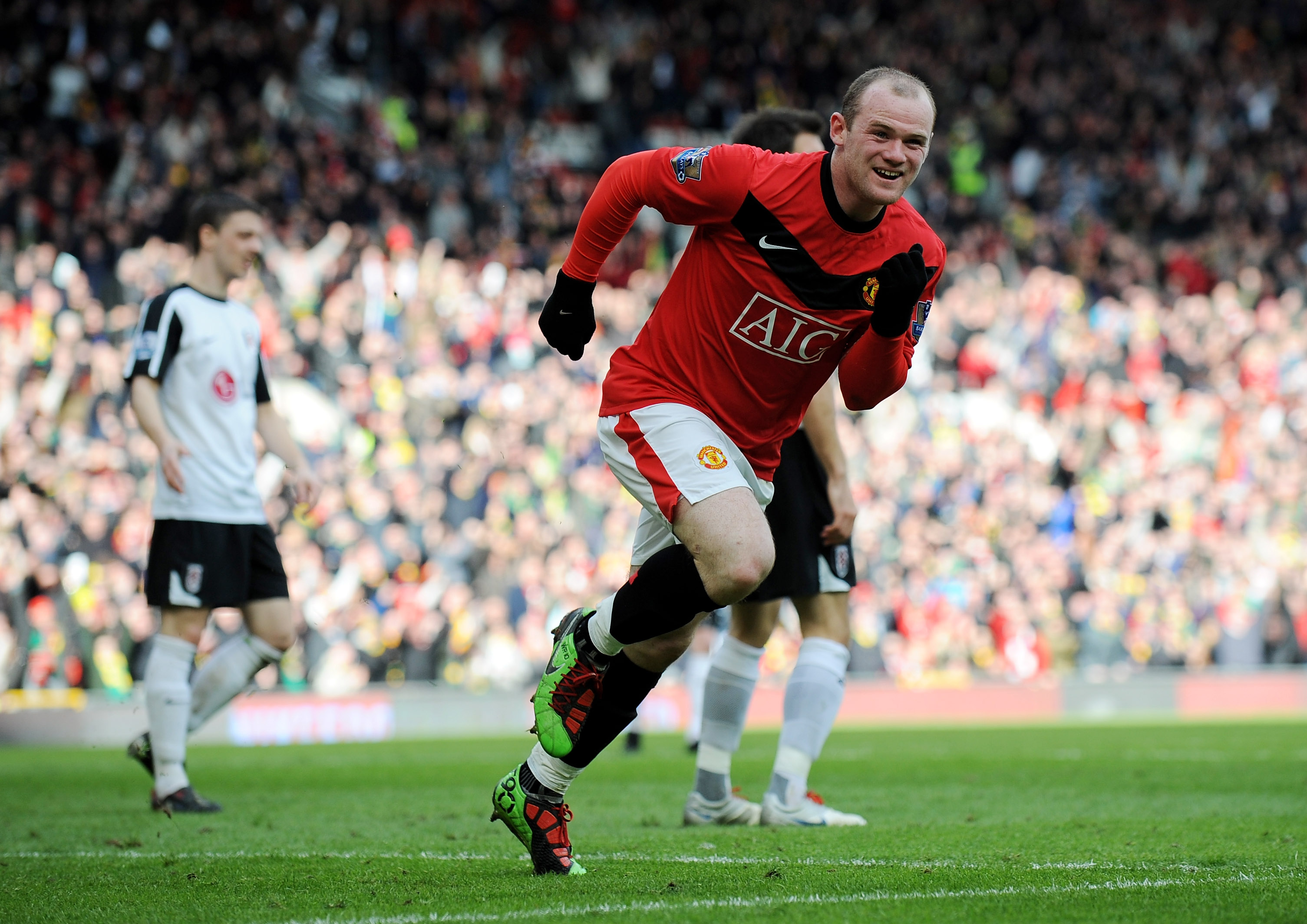 MANCHESTER, ENGLAND - MARCH 14:  Wayne Rooney of Manchester United celebrates scoring the first goal during the Barclays Premier League match between Manchester United and Fulham at Old Trafford on March 14, 2010 in Manchester, England.  (Photo by Michael