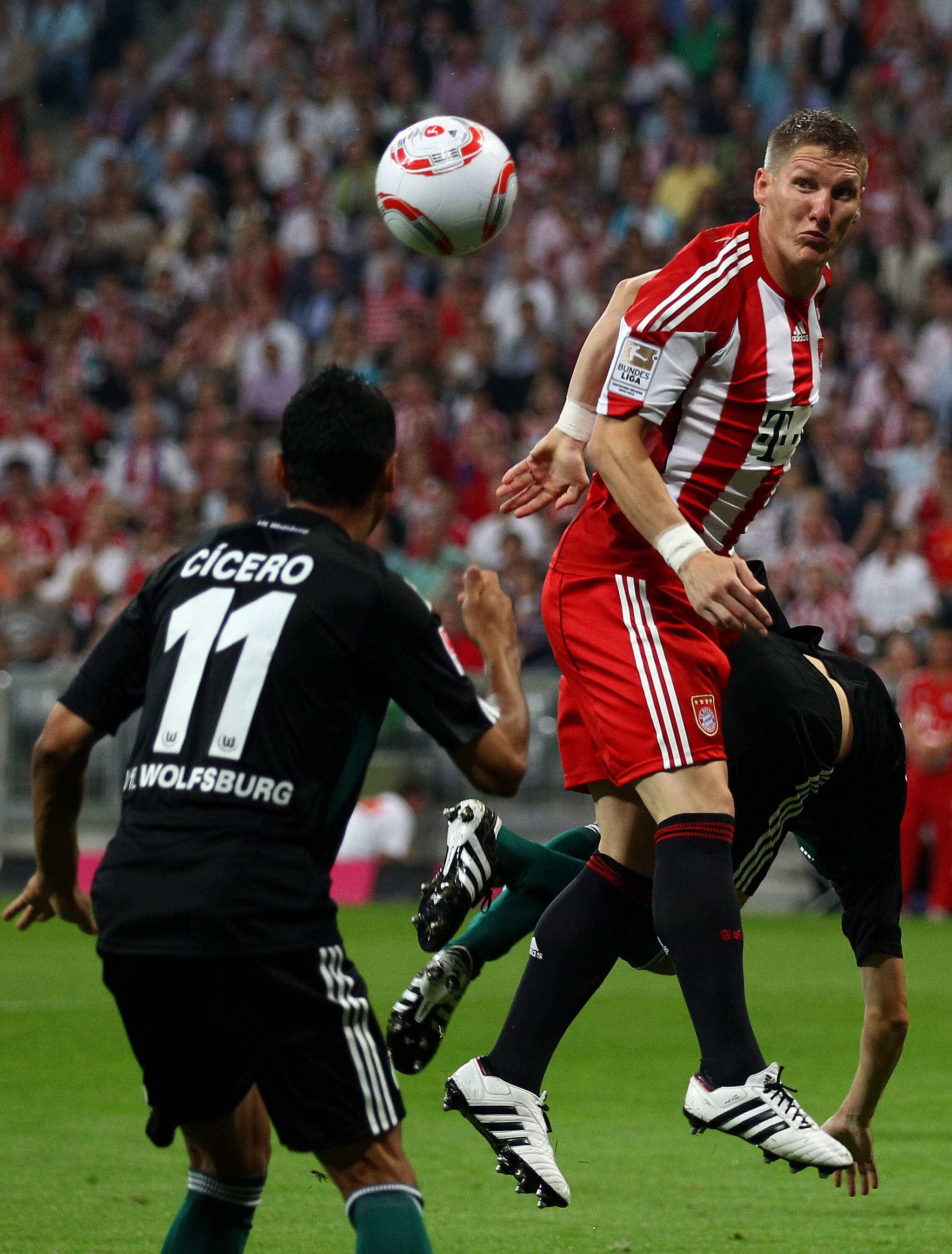 MUNICH, GERMANY - AUGUST 20: Bastian Schweinsteiger of Bayern jumps for a header during the Bundesliga match between FC Bayern Muenchen and VfL Wolfsburg at Allianz Arena on August 20, 2010 in Munich, Germany.  (Photo by Clive Brunskill/Getty Images)