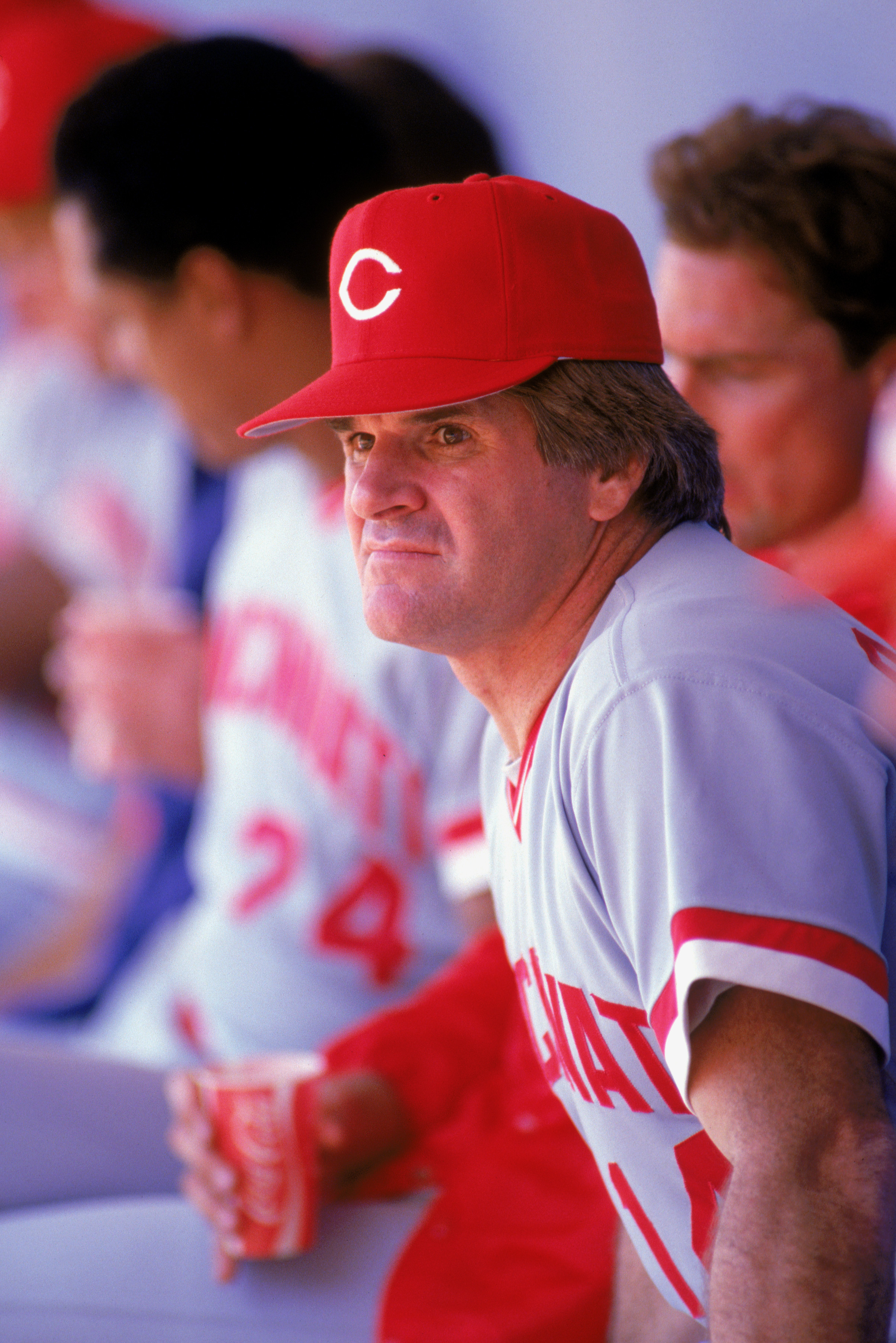 1985:  Pete Rose of the Cincinnati Reds watches from the dug-out during a MLB game in the 1985 season. ( Photo by: Rick Stewart/Getty Images)