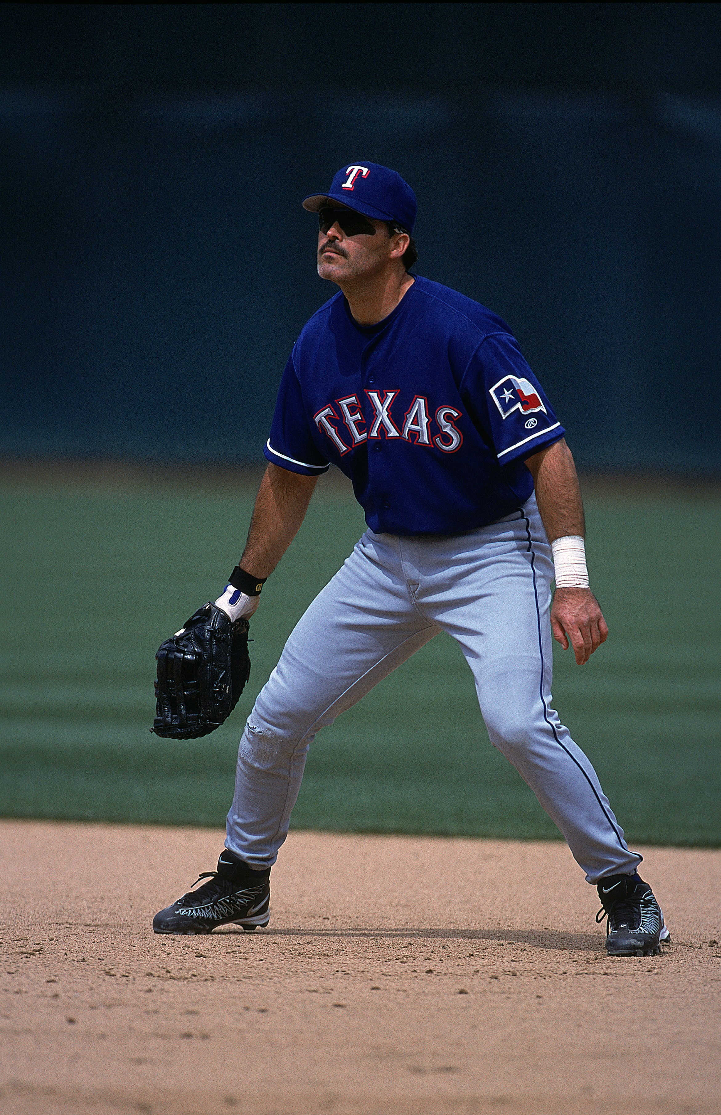24 Jun 2001:  Raphael Palmeiro #25 of the Texas Rangers is ready in the infield during the game against the Oakland Athletics at the Network Associates Colseum in Oakland, California.  The Rangers defeated the Athletics 9-5.Mandatory Credit: Tom Hauck  /A