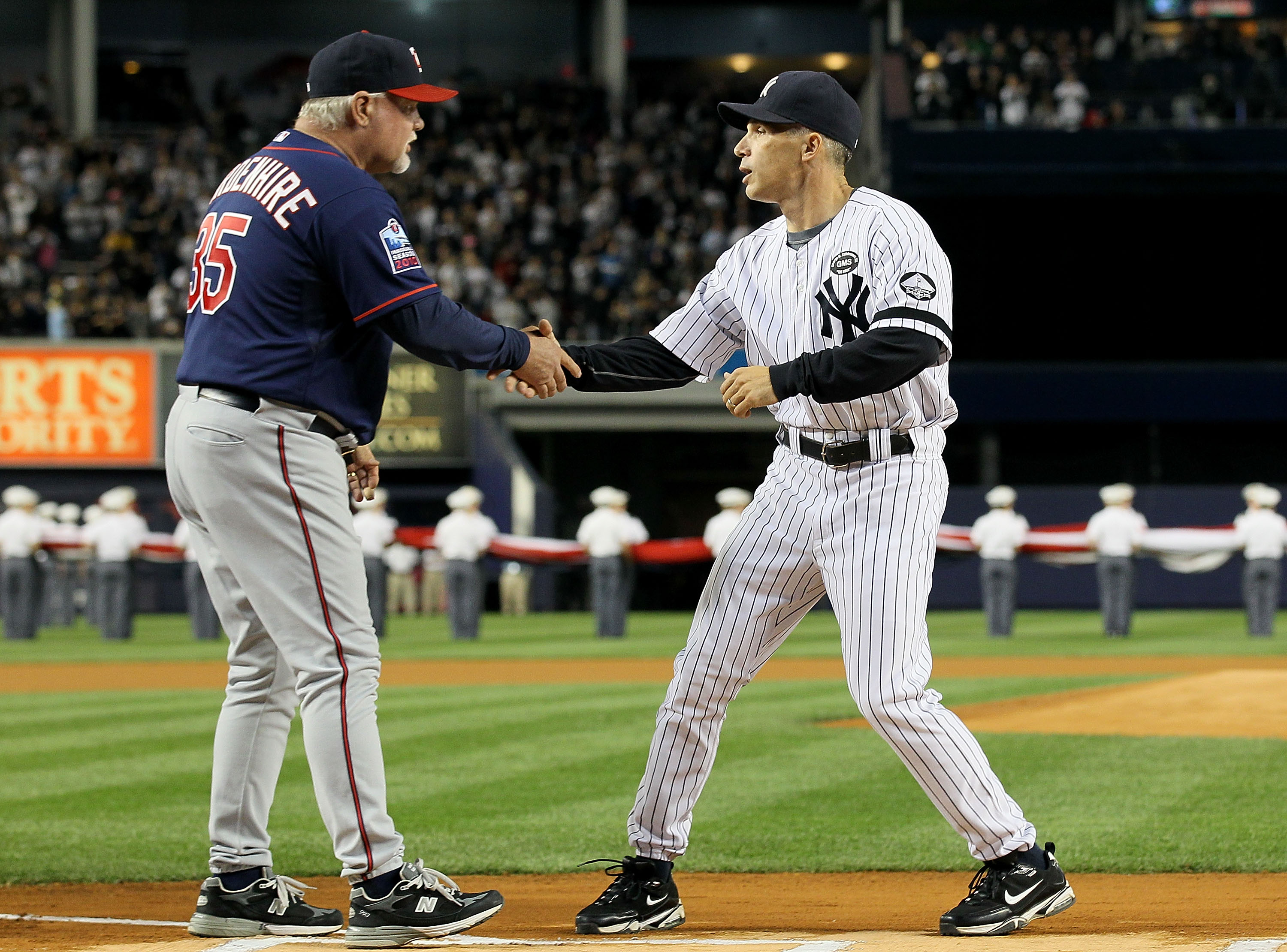 NEW YORK - OCTOBER 09:  Manager Joe Girardi #28 (R) of the New York Yankees greets manager Ron Gardenhire #35 of the Minnesota Twins prior to Game Three of the ALDS part of the 2010 MLB Playoffs at Yankee Stadium on October 9, 2010 in the Bronx borough of