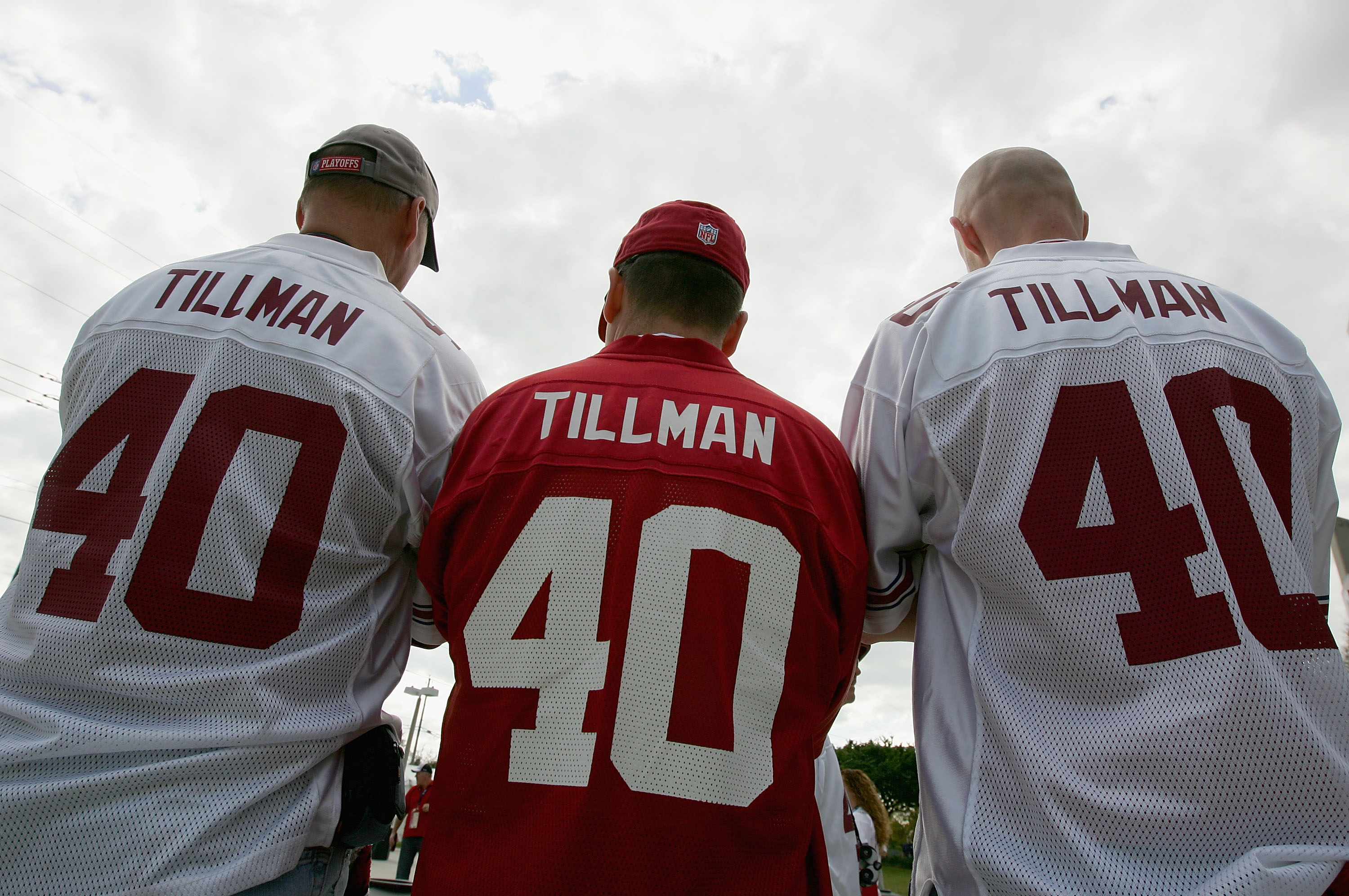 TAMPA, FL - FEBRUARY 01:  Arizona Cardinals fans wearing Pat Tillman jerseys (L-R) Dave Schile, Bruce Goff and Dave Schile Jr. look on outside of Raymond James Stadium before Super Bowl XLIII on February 1, 2009 at Raymond James Stadium in Tampa, Florida.