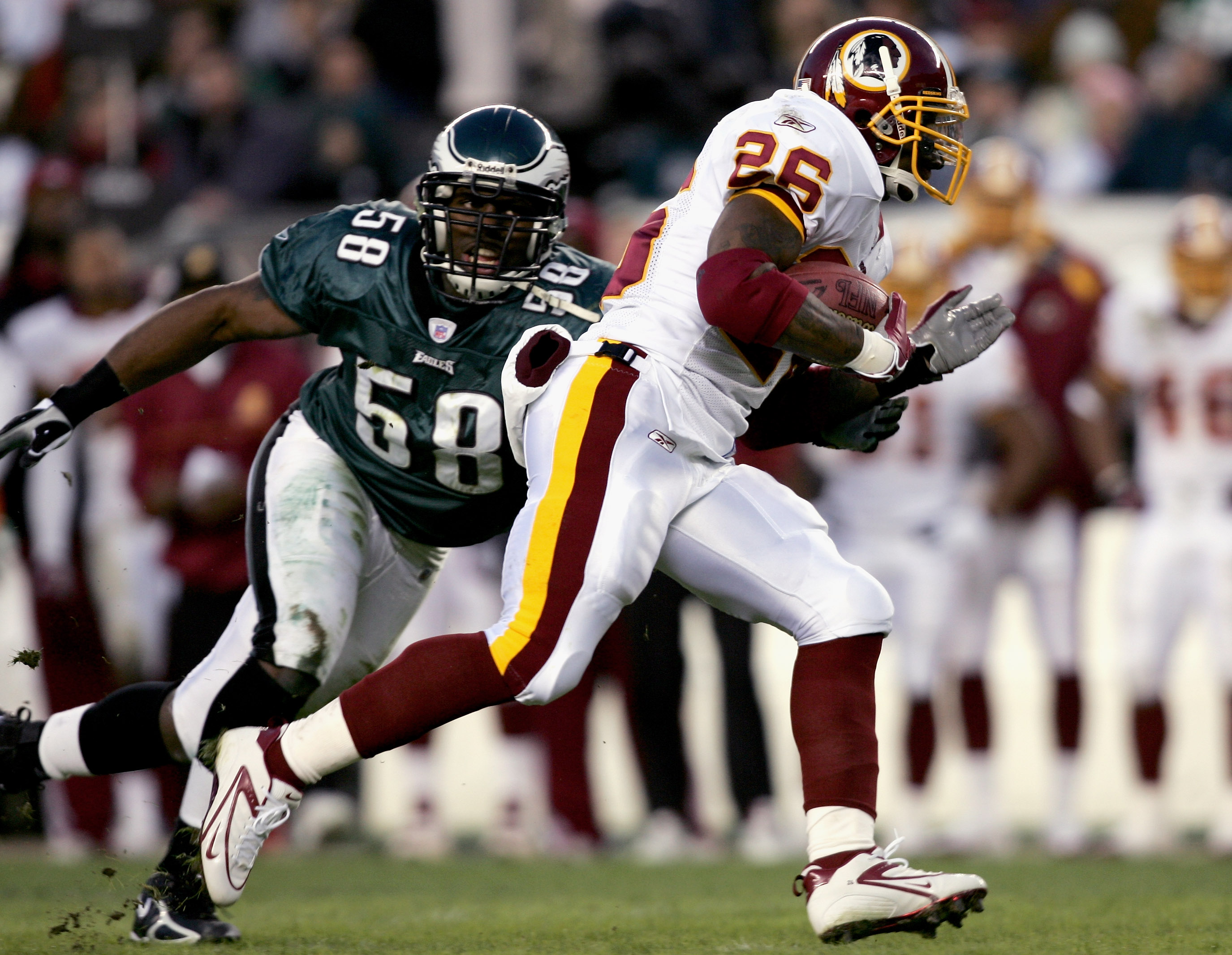 Philadelphia, Pennsylvania, USA. 3rd Dec, 2018. Washington Redskins  quarterback Colt McCoy (12) in action as offensive tackle Trent Williams (71)  deals with Philadelphia Eagles defensive end Brandon Graham (55) during the  NFL