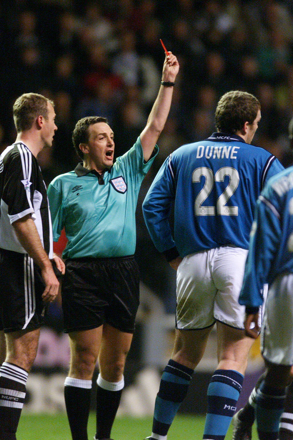 17 Feb 2002:  Referee Alan Wiley shows the red card to Richard Dunne of Manchester City during the AXA sponsored FA Cup fifth round match against Newcastle United played at St James Park, in Newcastle, England. Newcastle United won the match 1-0. DIGITALI