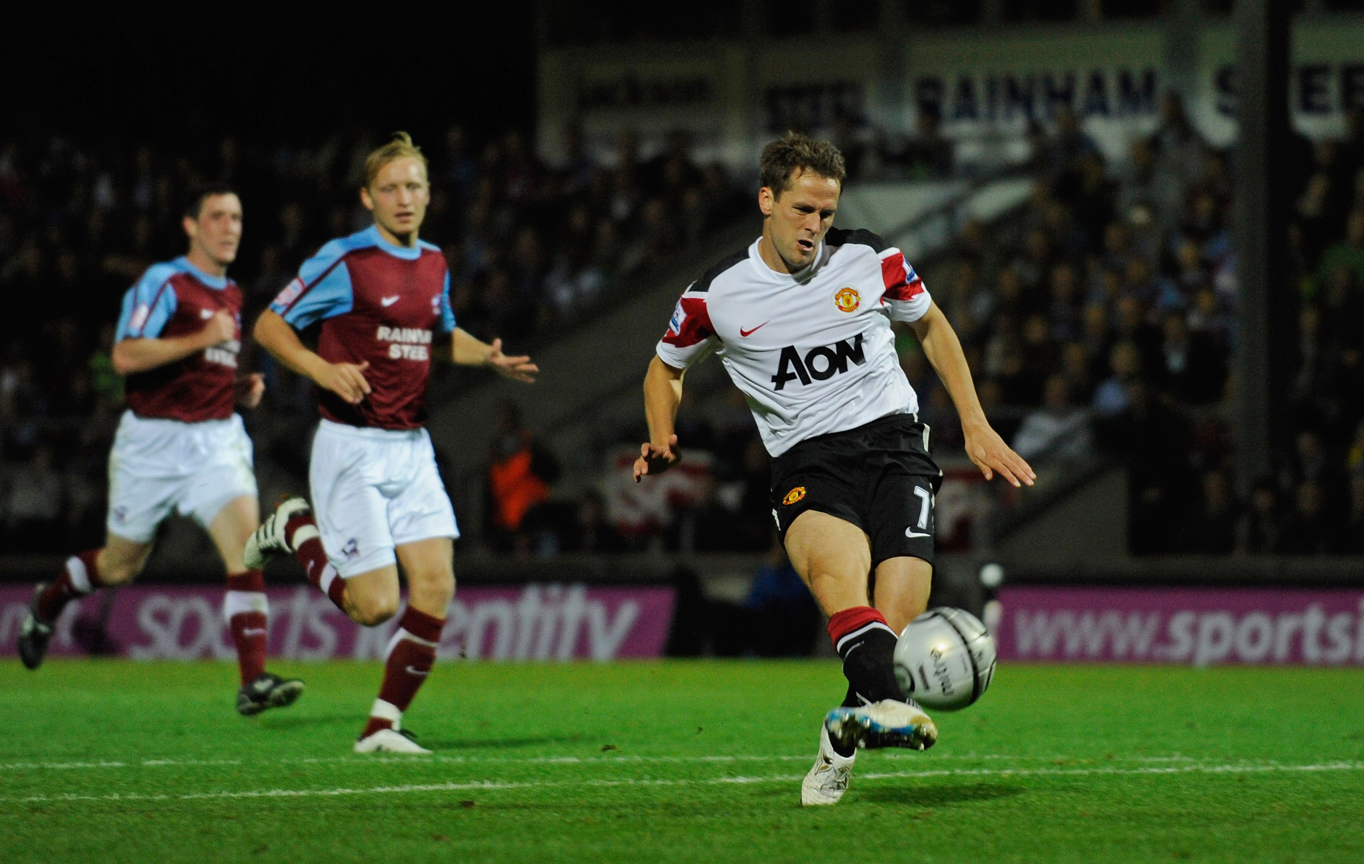SCUNTHORPE, ENGLAND - SEPTEMBER 22: Michael Owen of Manchester United scores from the spot to make it 3-1 during the Carling Cup 3rd Round match between Scunthorpe United and Manchester United at Glanford Park on September 22, 2010 in Scunthorpe, England.