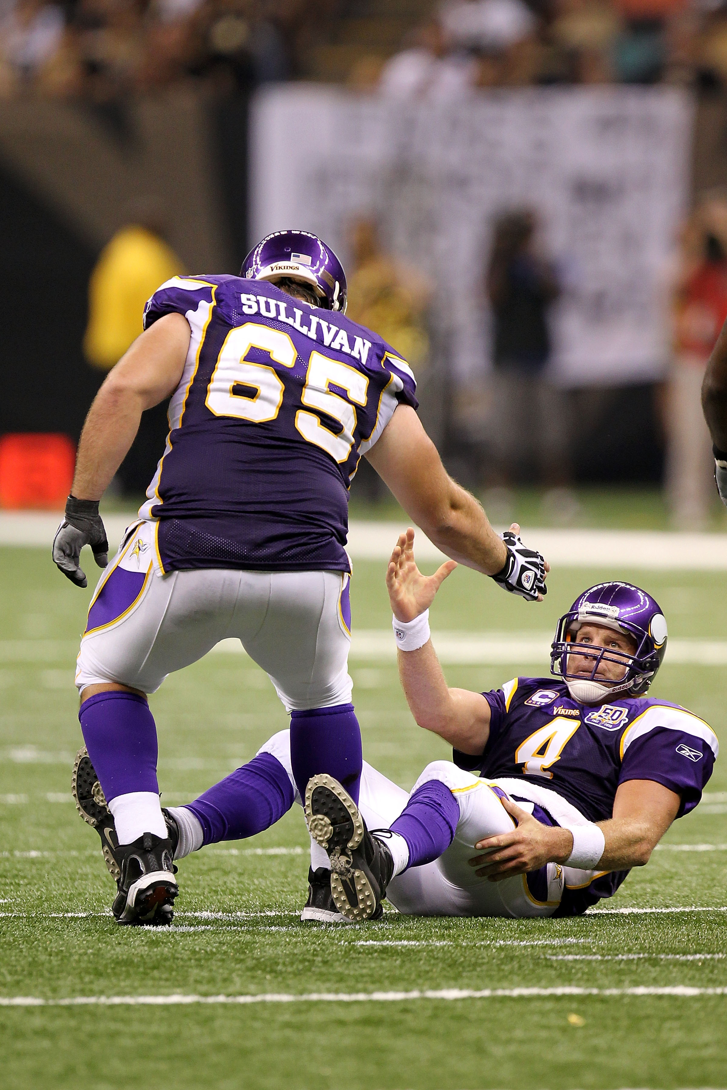 Quarterback Brett Favre and Bryant Phil Loadholt of the Minnesota News  Photo - Getty Images