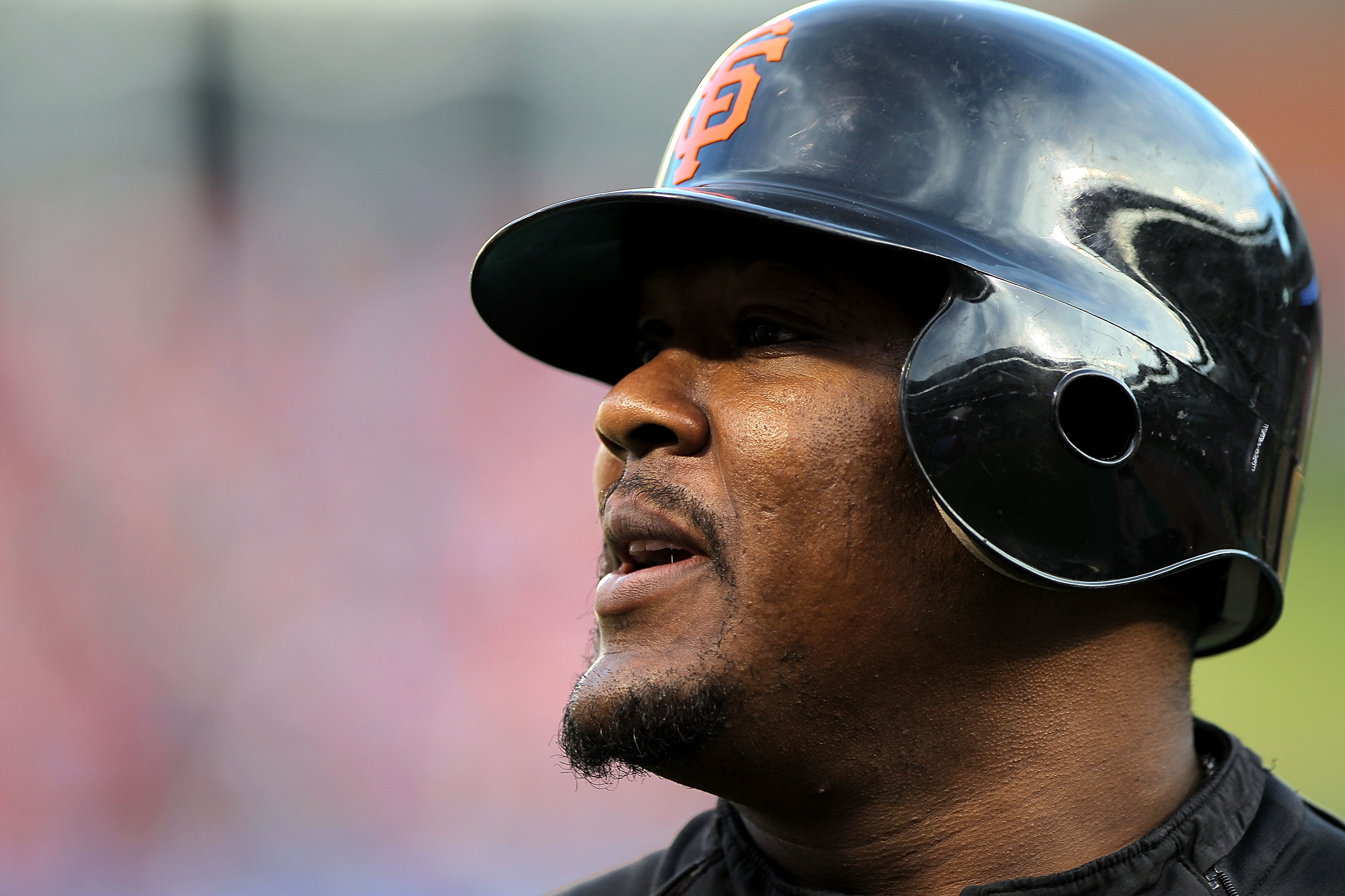 ARLINGTON, TX - NOVEMBER 01:  Juan Uribe #5 of the San Francisco Giants looks on during batting practice against the Texas Rangers in Game Five of the 2010 MLB World Series at Rangers Ballpark in Arlington on November 1, 2010 in Arlington, Texas.  (Photo