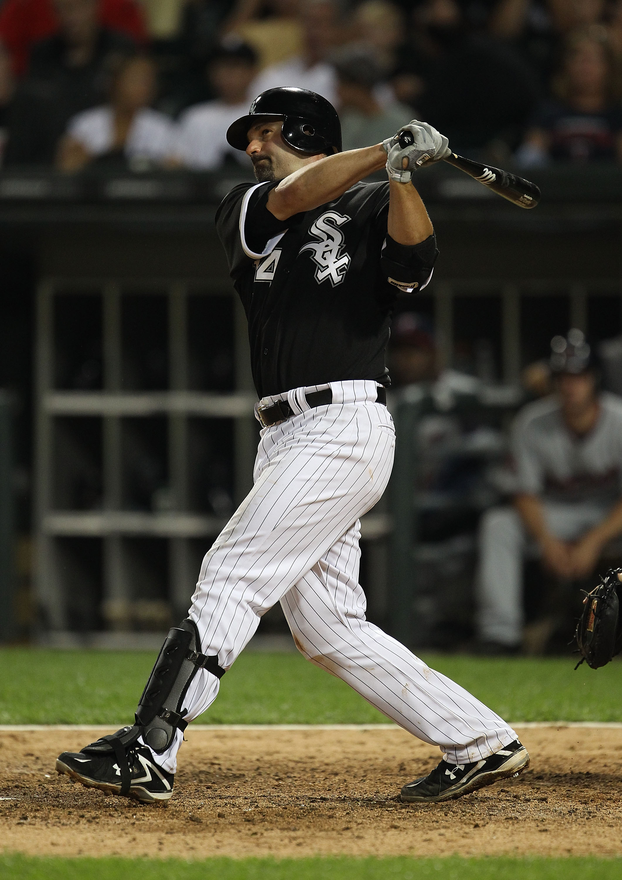 CHICAGO, IL - JULY 23: Outfielder Scott Podsednik #22 of the Chicago White  Sox follows through on his swing after hitting the baseball against the  Tampa Bay Rays at U.S, Cellular Field