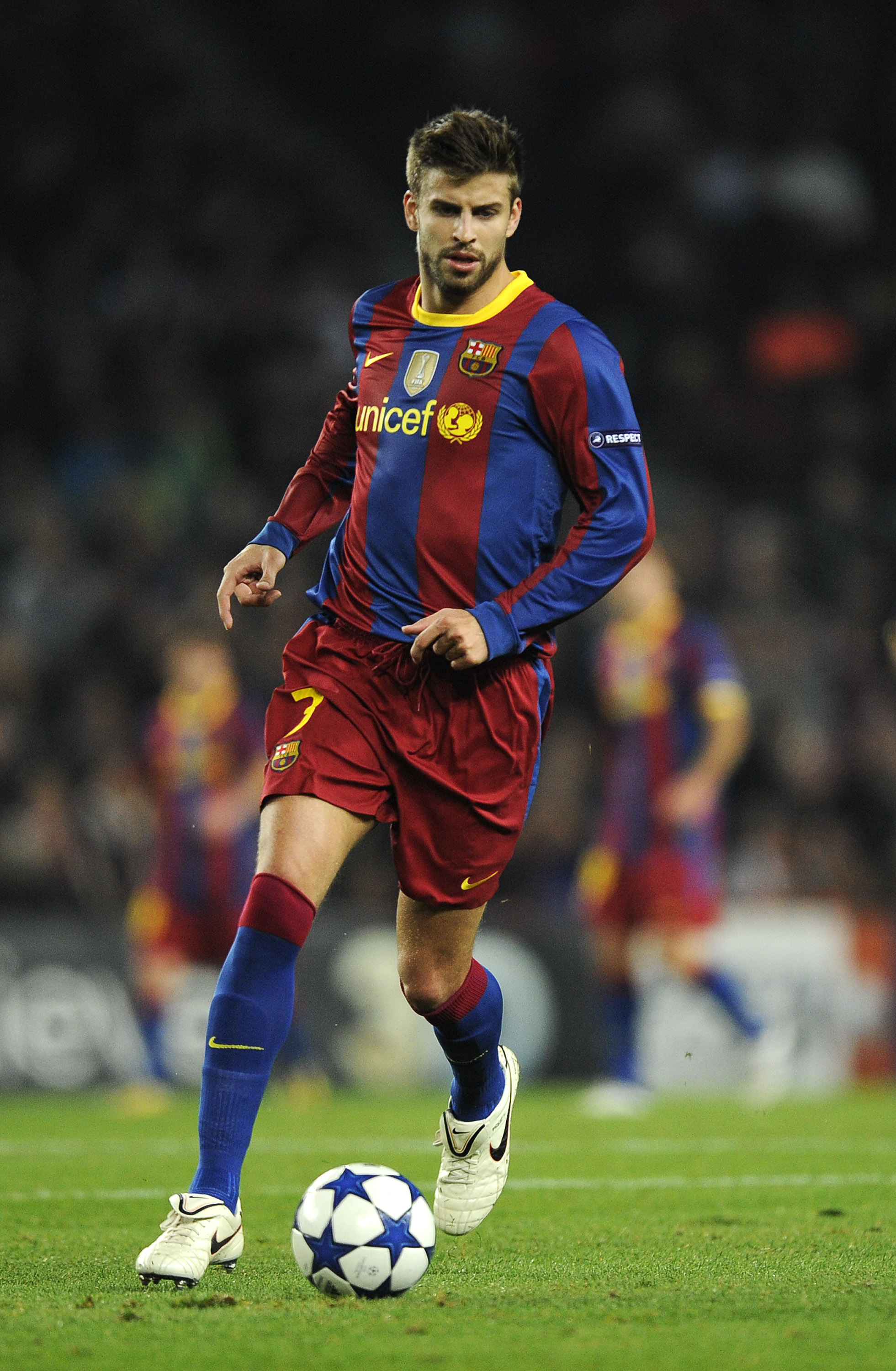 BARCELONA, SPAIN - OCTOBER 20:  Gerard Pique of Barcelona runs with ball during the UEFA Champions League group D match between Barcelona and FC Copenhagen at the Camp nou stadium on October 20, 2010 in Barcelona, Spain. Barcelona won the match 2-0.  (Pho