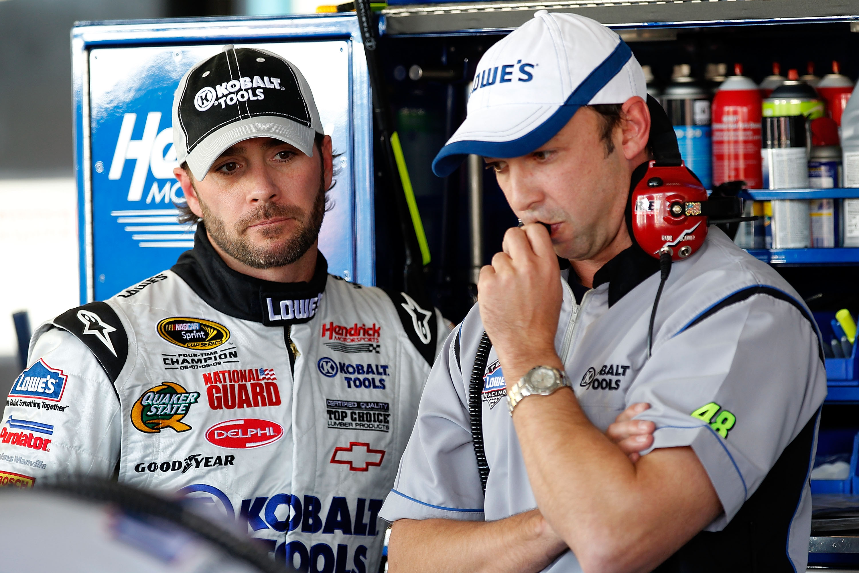 AVONDALE, AZ - NOVEMBER 12:  (L-R) Jimmie Johnson, driver of the #48 Lowe's Chevrolet, stands in the garage with his crew chief, Chad Knaus during practice for the NASCAR Sprint Cup Series Kobalt Tools 500 at Phoenix International Raceway on November 12,