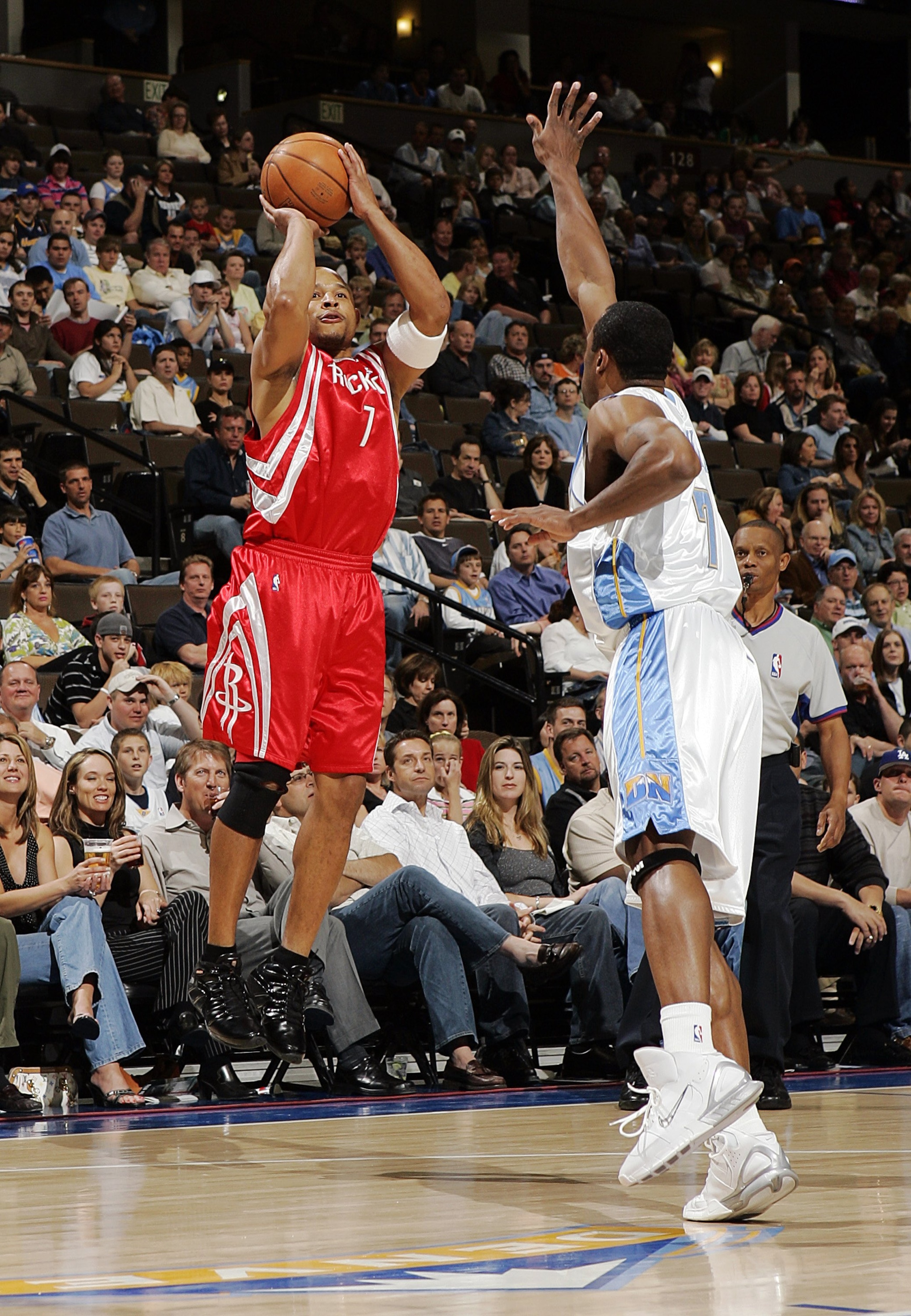 DENVER - APRIL 17: David Wesley #7 of the Houston Rockets shoots over Greg Buckner #7 of the Denver Nuggets in the first quarter on April 17, 2006 at the Pepsi Center in Denver, Colorado. NOTE TO USER: USER expressly acknowledges and agrees that, by dow DENVER - APRIL 17: David Wesley #7 of the Houston Rockets shoots over Greg Buckner #7 of the Denver Nuggets in the first quarter on April 17, 2006 at the Pepsi Center in Denver, Colorado. NOTE TO USER: USER expressly acknowledges and agrees that, by dow