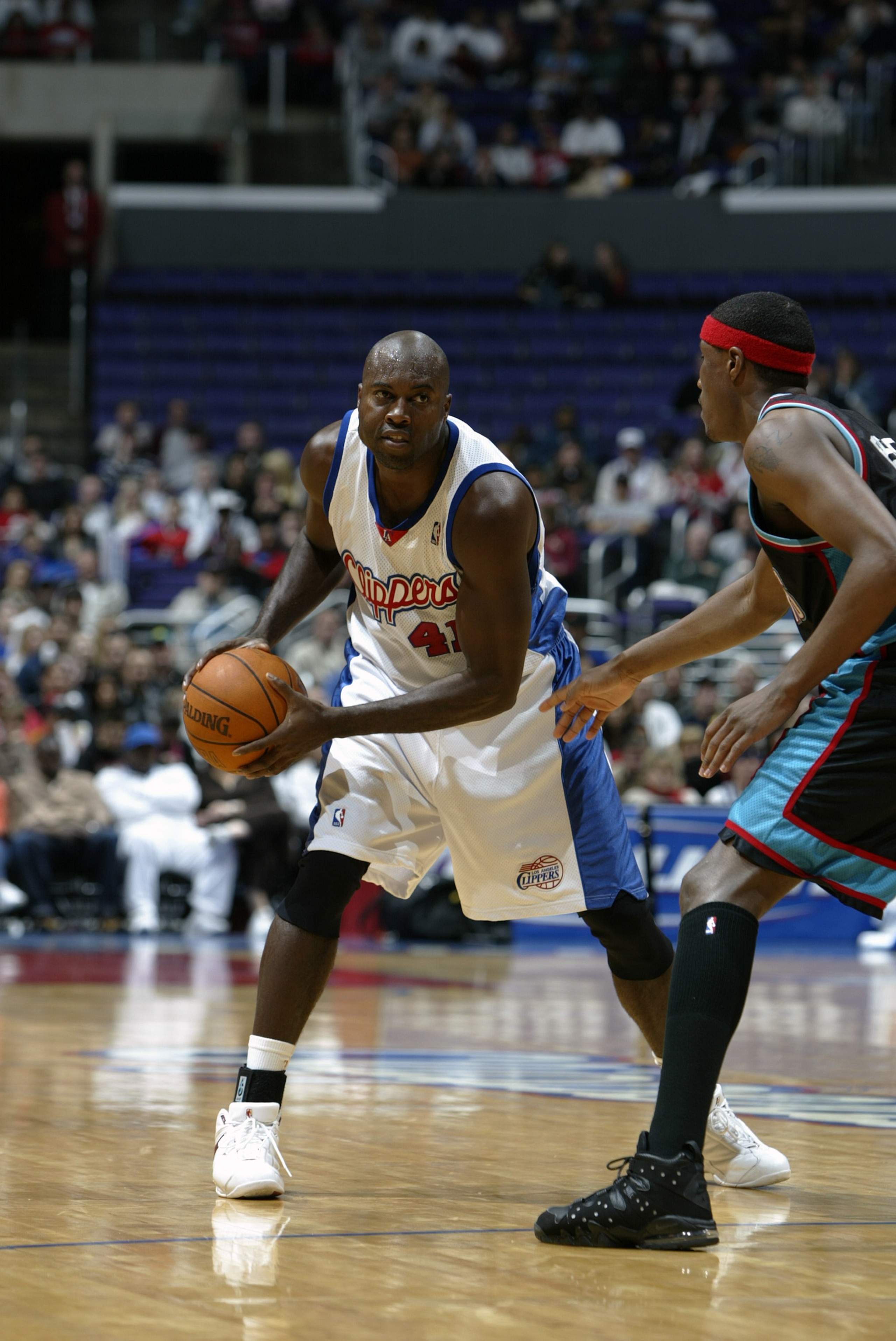 LOS ANGELES - JANUARY 11: Glenn Rice #41 of the Los Angeles Clippers looks to pass as he is covered by James Posey #41 of the Memphis Grizzlies on January 11, 2004 at the Staples Center in Los Angeles, California. The Grizzlies won 108-107. NOTE TO USE LOS ANGELES - JANUARY 11: Glenn Rice #41 of the Los Angeles Clippers looks to pass as he is covered by James Posey #41 of the Memphis Grizzlies on January 11, 2004 at the Staples Center in Los Angeles, California. The Grizzlies won 108-107. NOTE TO USE