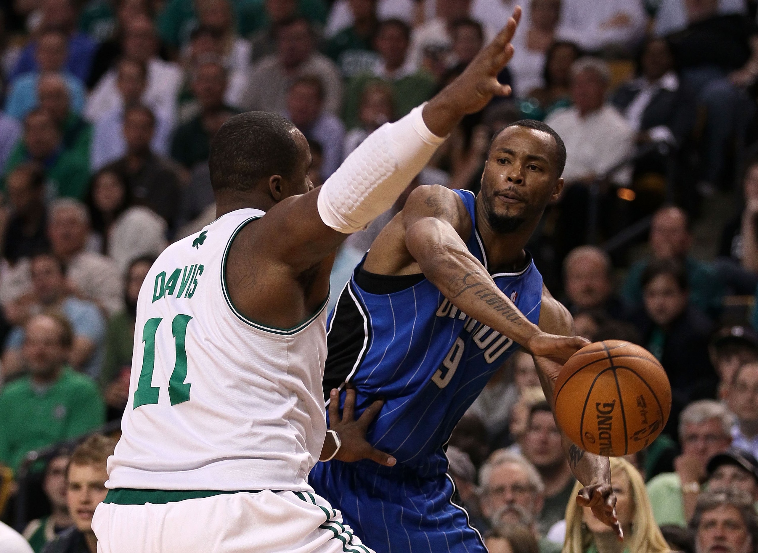 BOSTON - MAY 28: Rashard Lewis #9 of the Orlando Magic looks to pass the ball against Glen Davis #11 of the Boston Celtics in Game Six of the Eastern Conference Finals during the 2010 NBA Playoffs at TD Garden on May 28, 2010 in Boston, Massachusetts. N BOSTON - MAY 28: Rashard Lewis #9 of the Orlando Magic looks to pass the ball against Glen Davis #11 of the Boston Celtics in Game Six of the Eastern Conference Finals during the 2010 NBA Playoffs at TD Garden on May 28, 2010 in Boston, Massachusetts. N