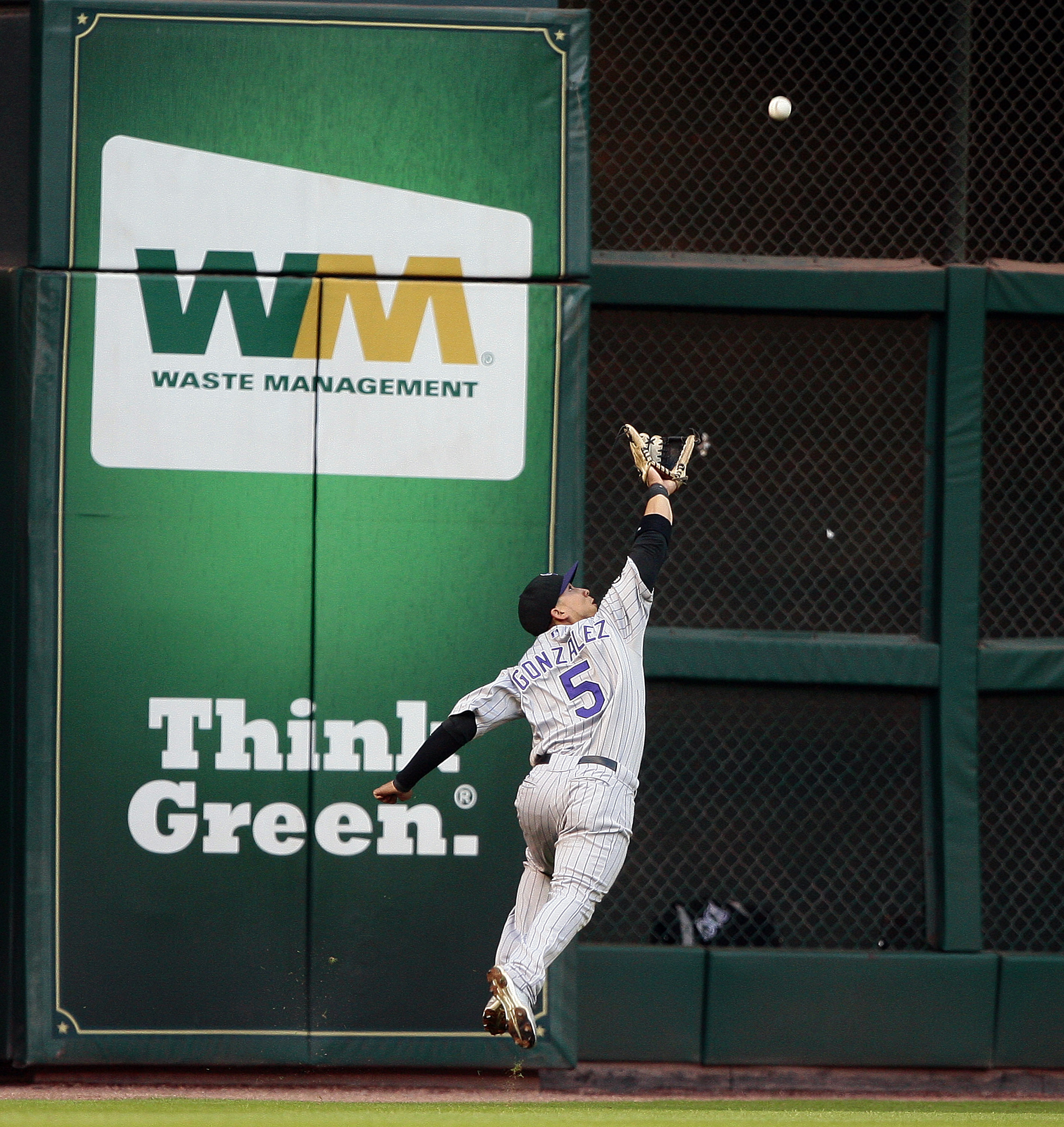 HOUSTON - MAY 19: Left fielder Carlos Gonzalez #5 of the Colorado Rockies can't reach a hard hit ball by Tommy Manzella of the Houston Astros at Minute Maid Park on May 19, 2010 in Houston, Texas. (Photo by Bob Levey/Getty Images)