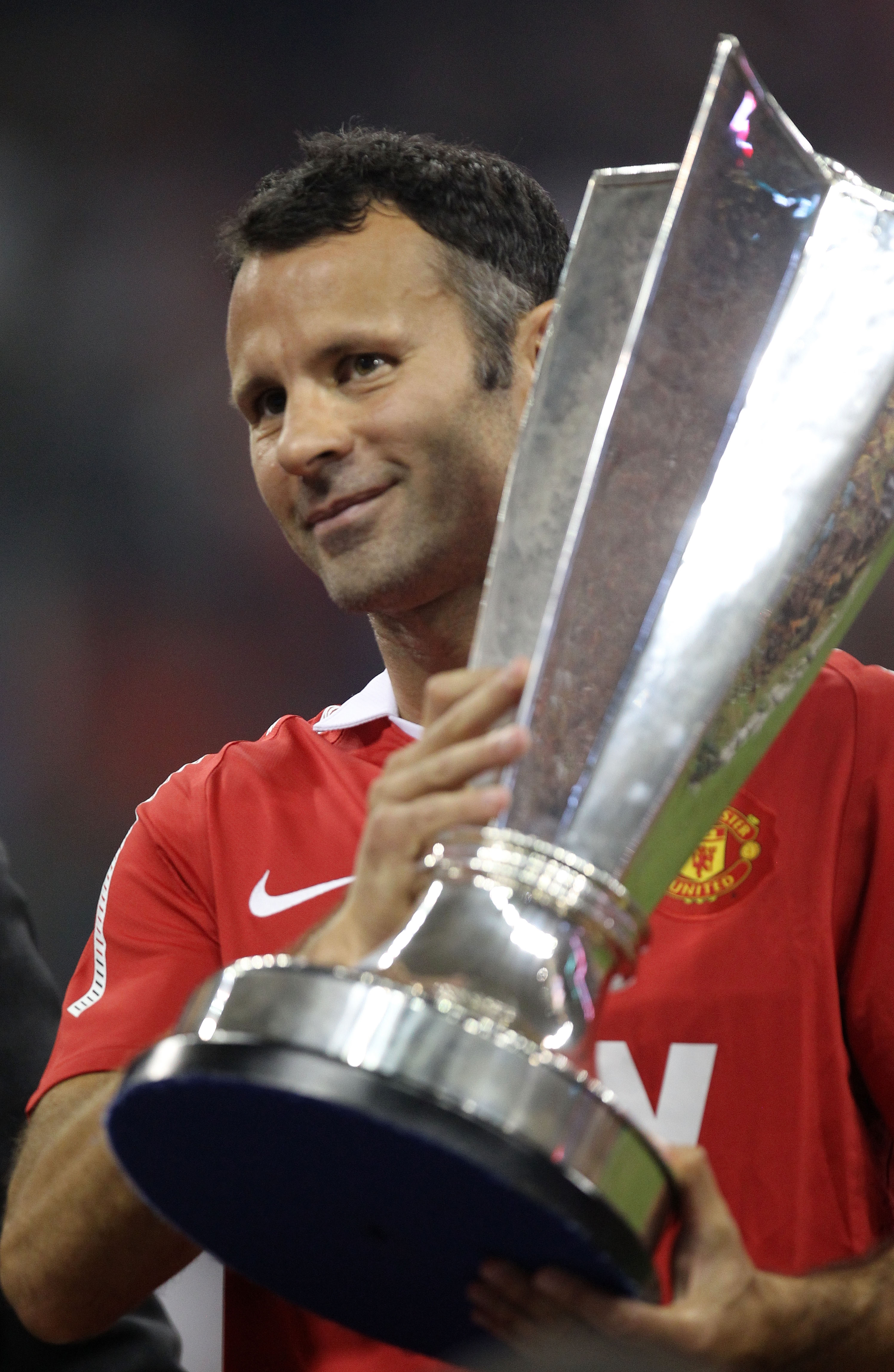 HOUSTON - JULY 28:  Ryan Giggs #11 of Manchester United holds the All-Star trophy following United's 5-2 win over the MLS All-Stars in the MLS All Star Game at Reliant Stadium on July 28, 2010 in Houston, Texas.  (Photo by Ronald Martinez/Getty Images)