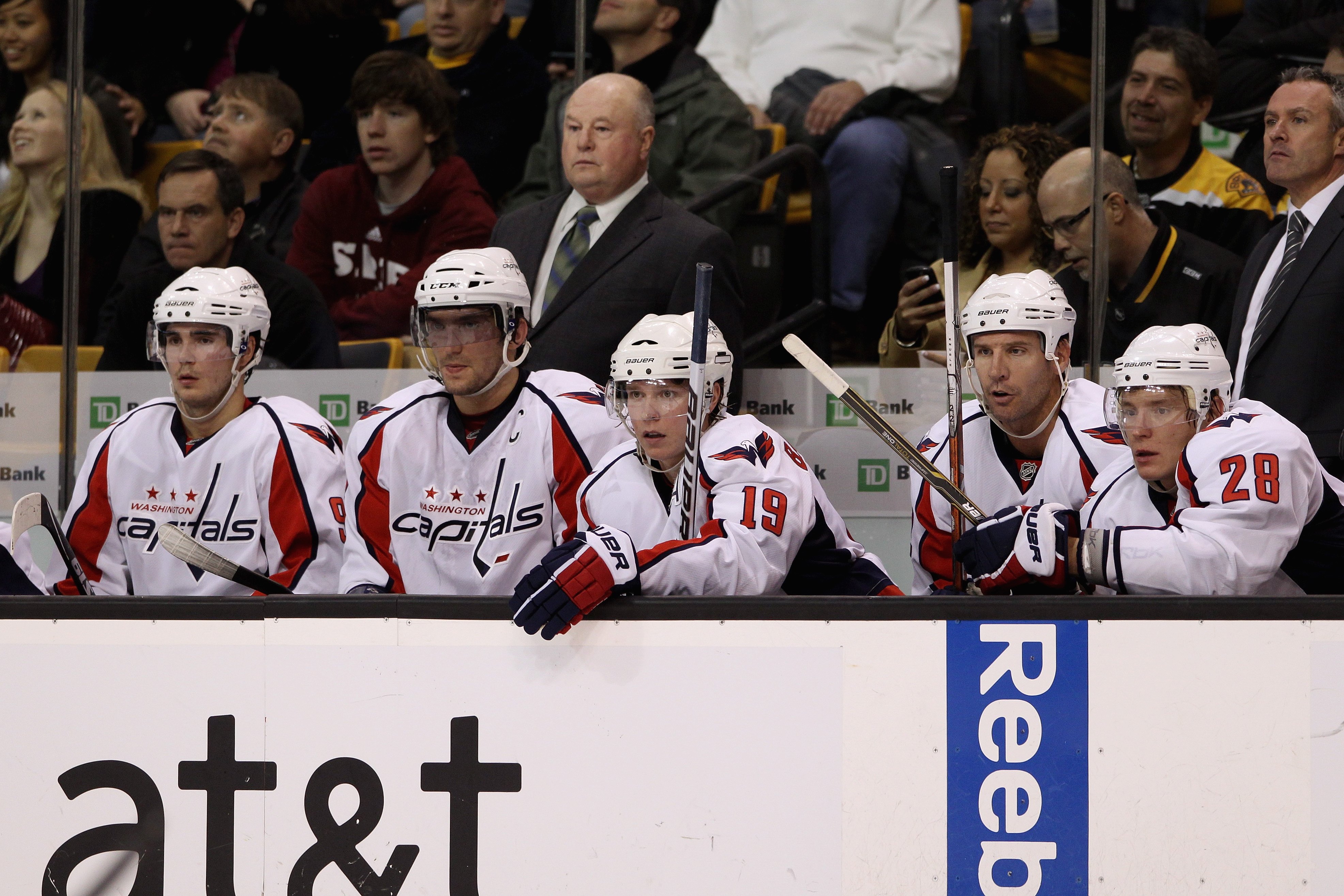 BOSTON - OCTOBER 21:  Head coach Bruce Boudreau of the Washington Capitals and (l-r) Marcus Johansson #90, Alex Ovechkin #8, Nicklas Backstrom #19, Mike Knuble #22, Alexander Semin #28 and assistant coach Dean Evason look on from the bench against the Bos