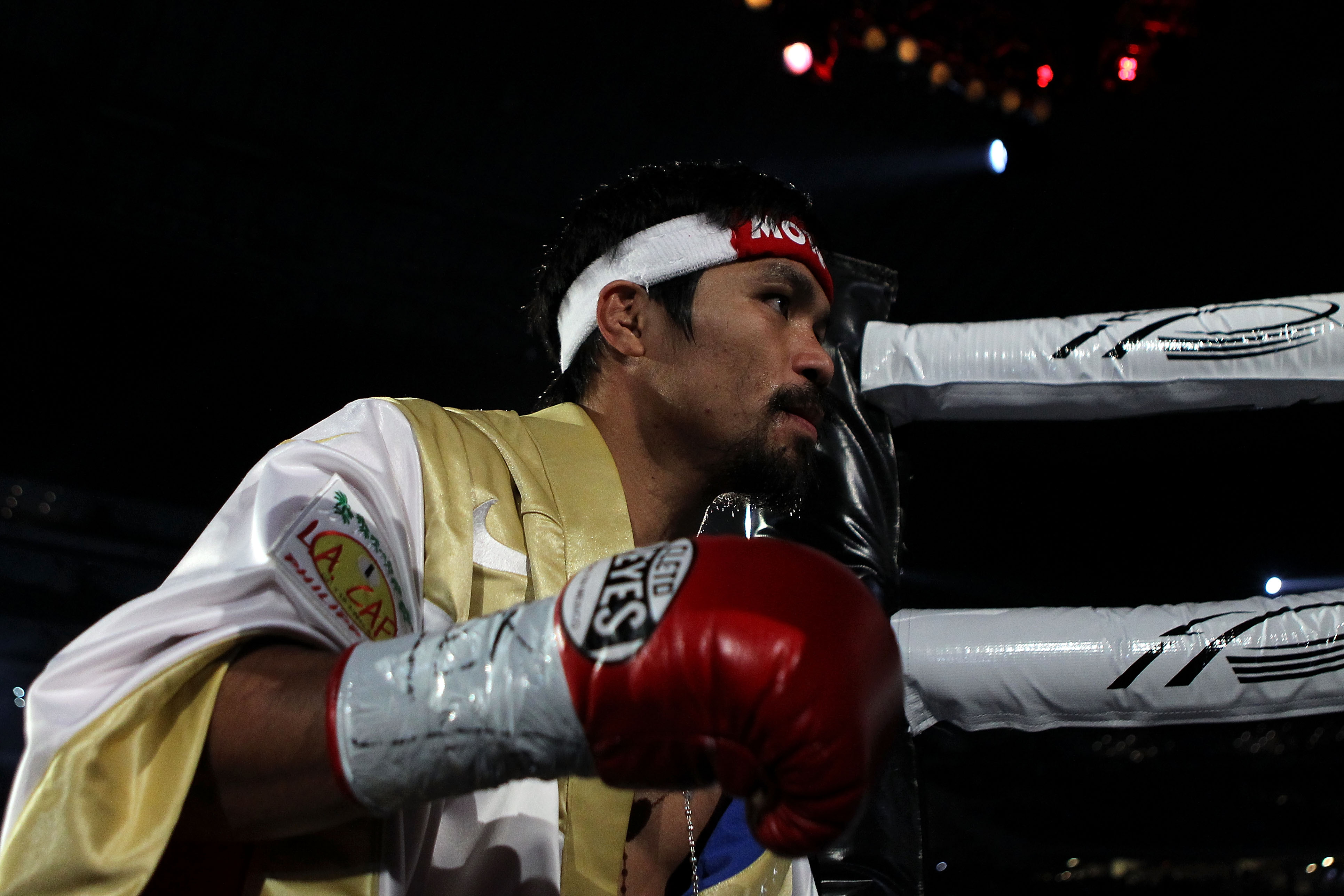 ARLINGTON, TX - NOVEMBER 13:  Manny Pacquiao of the Philippines makes his way to the ring for his fight against Antonio Margarito (black trunks) of Mexico during their WBC World Super Welterweight Title bout at Cowboys Stadium on November 13, 2010 in Arli